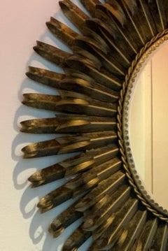 French gilded starburst iron mirror, mid-1900s.