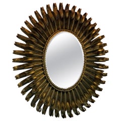French gilded starburst iron mirror, mid-1900s.
