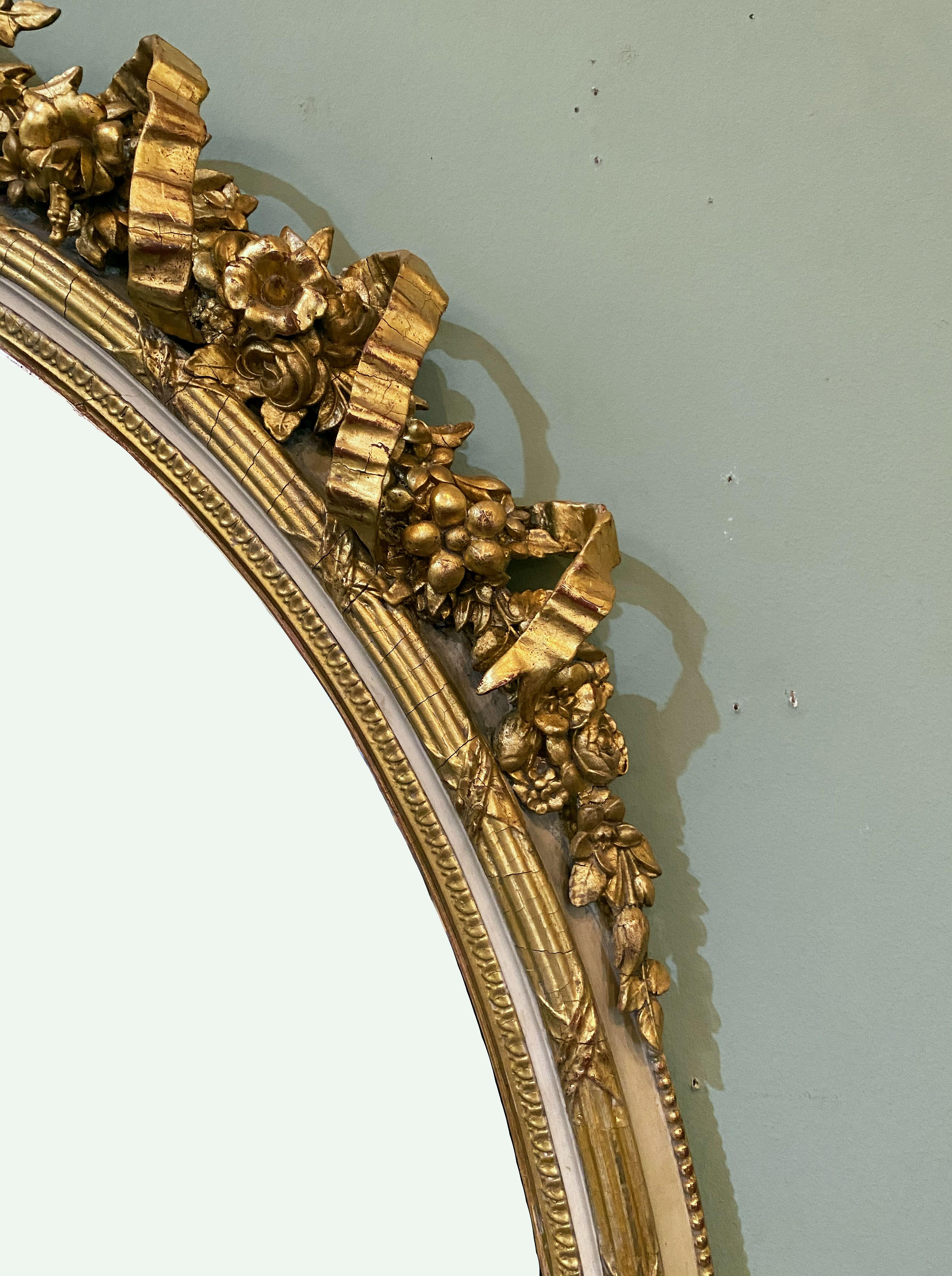 Glass French Gilt and Parcel Cream Oval Wall Mirror with Ribbon Tied Crest and Frieze 