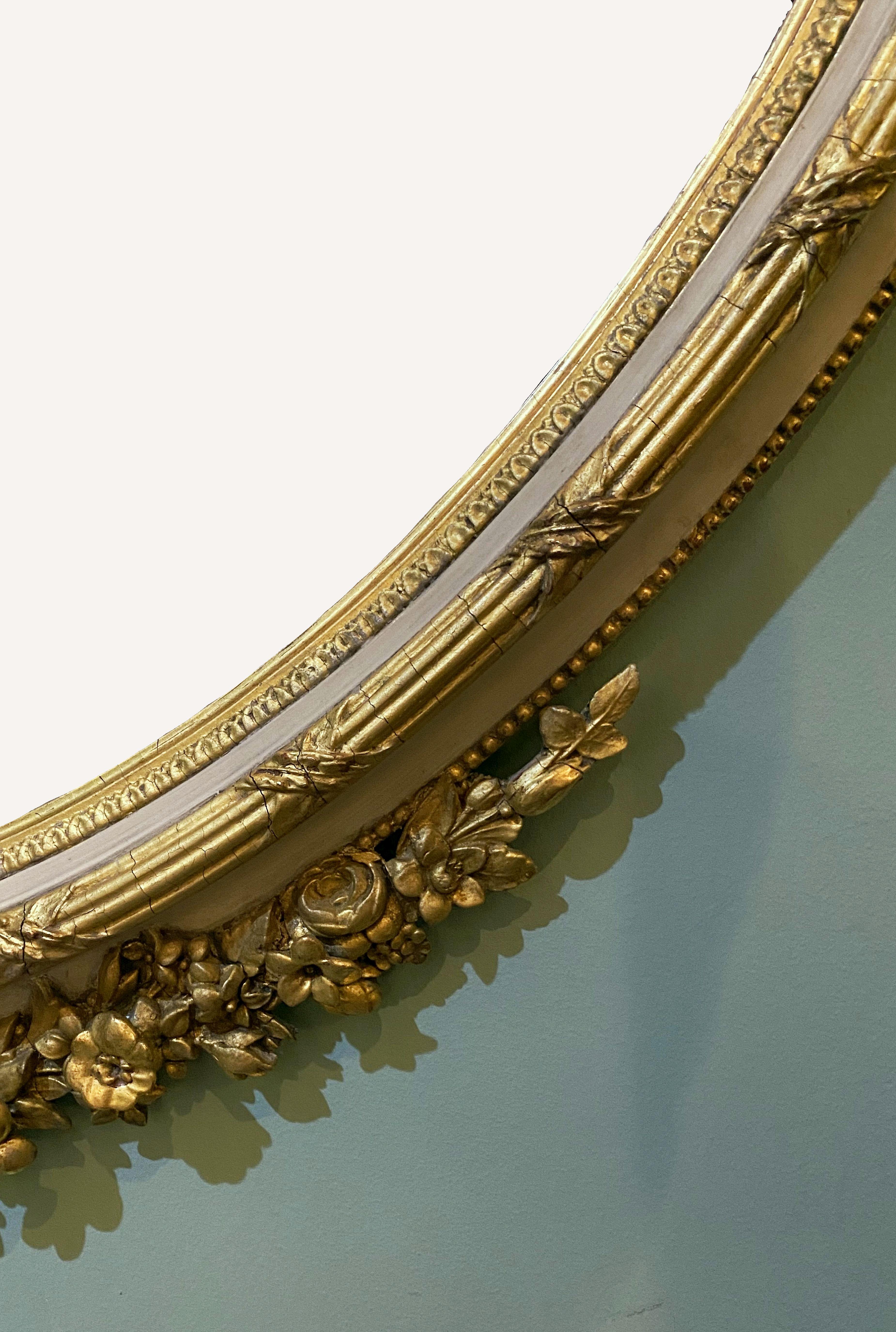 French Gilt and Parcel Cream Oval Wall Mirror with Ribbon Tied Crest and Frieze  2