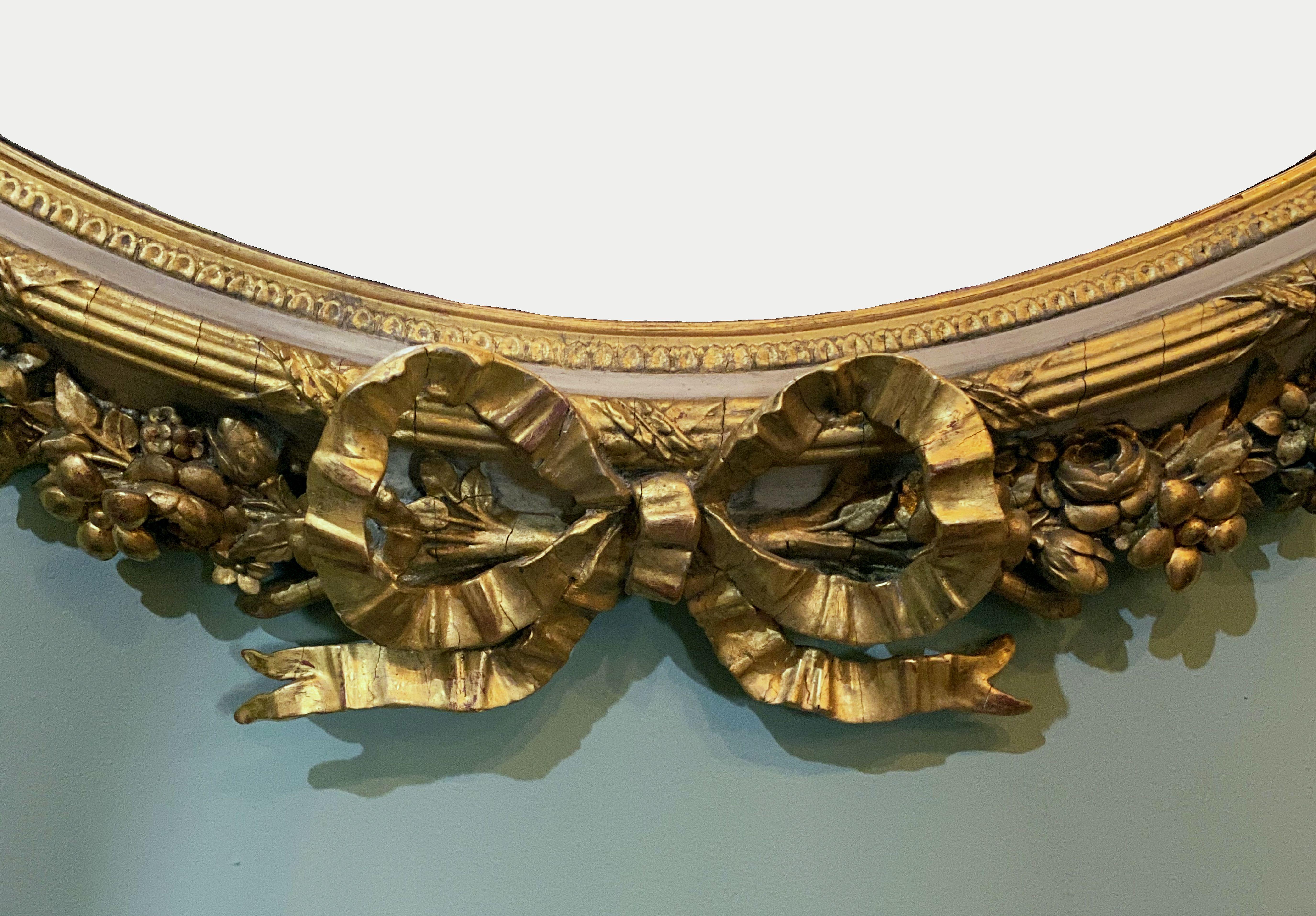 French Gilt and Parcel Cream Oval Wall Mirror with Ribbon Tied Crest and Frieze  3