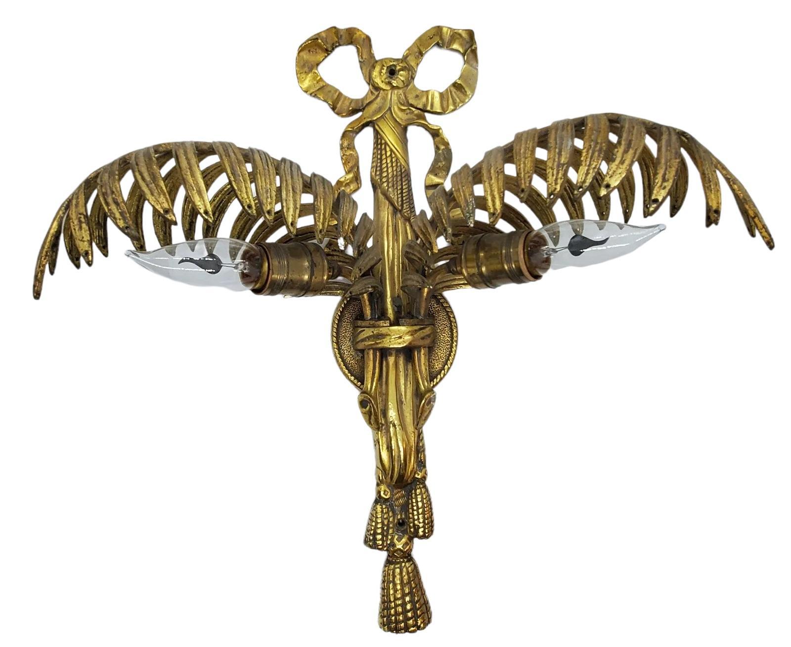 French Gilt Brass dual Light Leaf Sconce. Lights are in working order and have been tested. The gilt Brass has a beautiful French design and extends outward as a lively image.