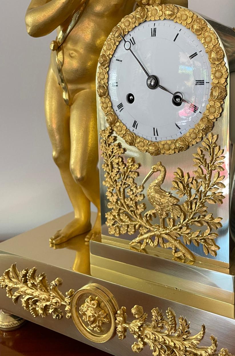 Brass Antique French Gilt Mantel Clock with Winged Cherub, Silk Suspension, circa 1830 For Sale