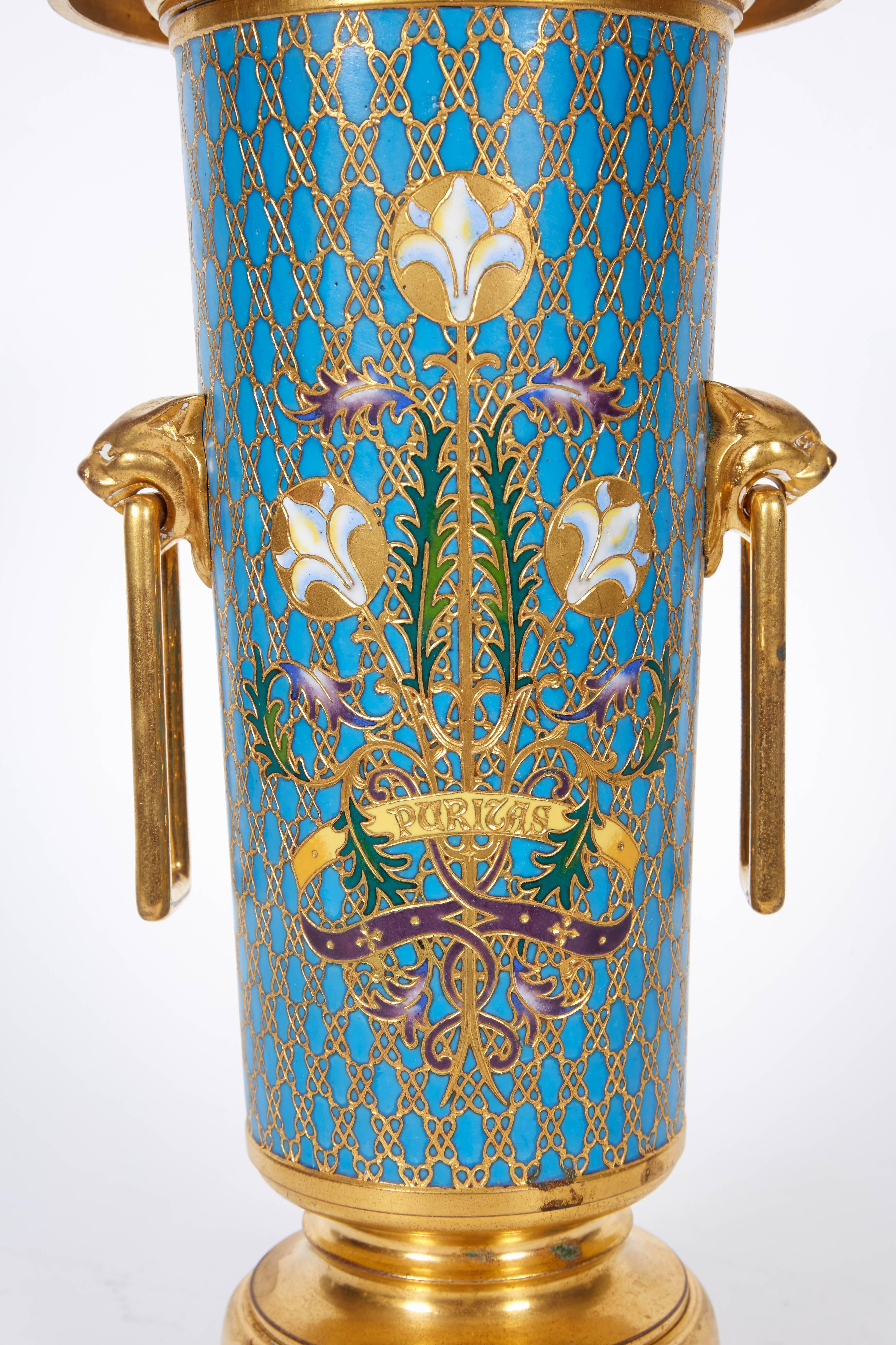 A large French gilt bronze and Champleve cloisonne enamel vase by Ferdinand Barbedienne, circa 1880.

Signed F. Barbedienne


Measures: 12