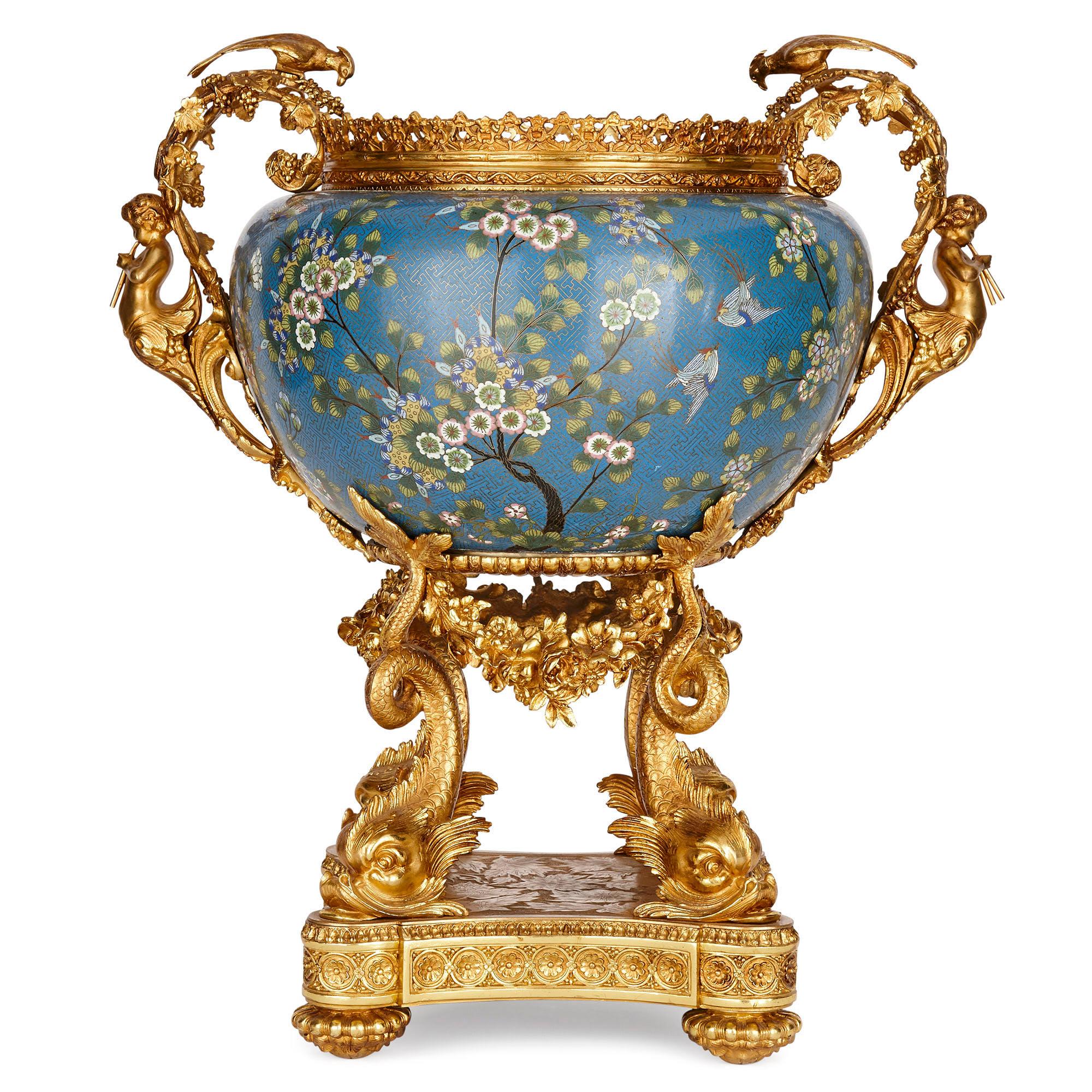 French gilt bronze and Chinese cloisonné enamel jardinière
French and Chinese, early 20th century
Measures: Height 63cm, width 58cm, depth 40cm

This piece is a superb example of East meets West: of Chinese cloisonné enamel paired with French