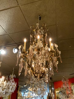 French Gilt Bronze and Crystal 12 Light Chandelier with Central Post in Crystal