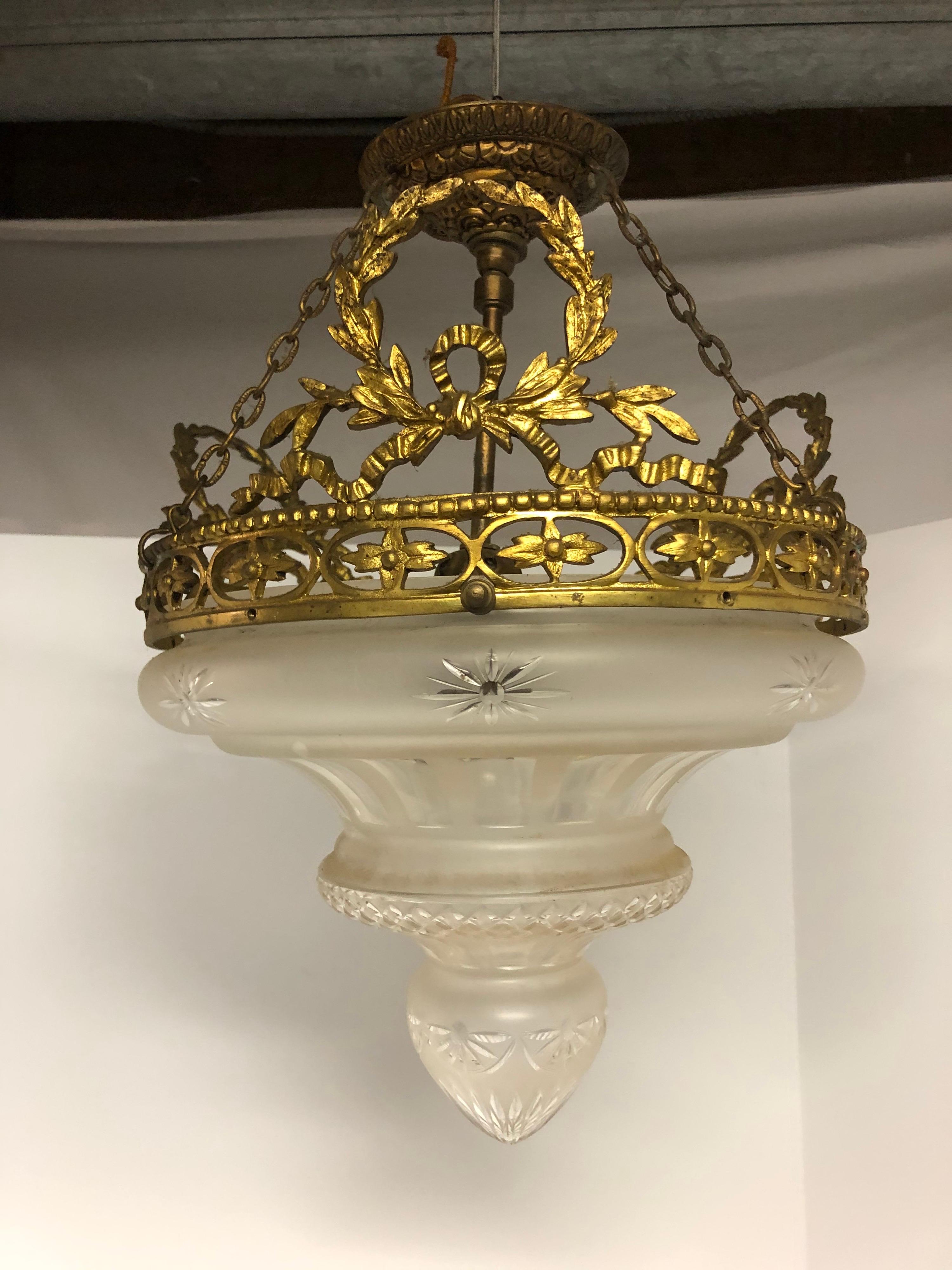 Gilt bronze and cut glass chandelier. Few chips on inside of lip on glass that can not be seen at all when hanging, no cracks. Glass is in very good condition. Chandelier is very impressive when hung. Single socket. Amazing glass!