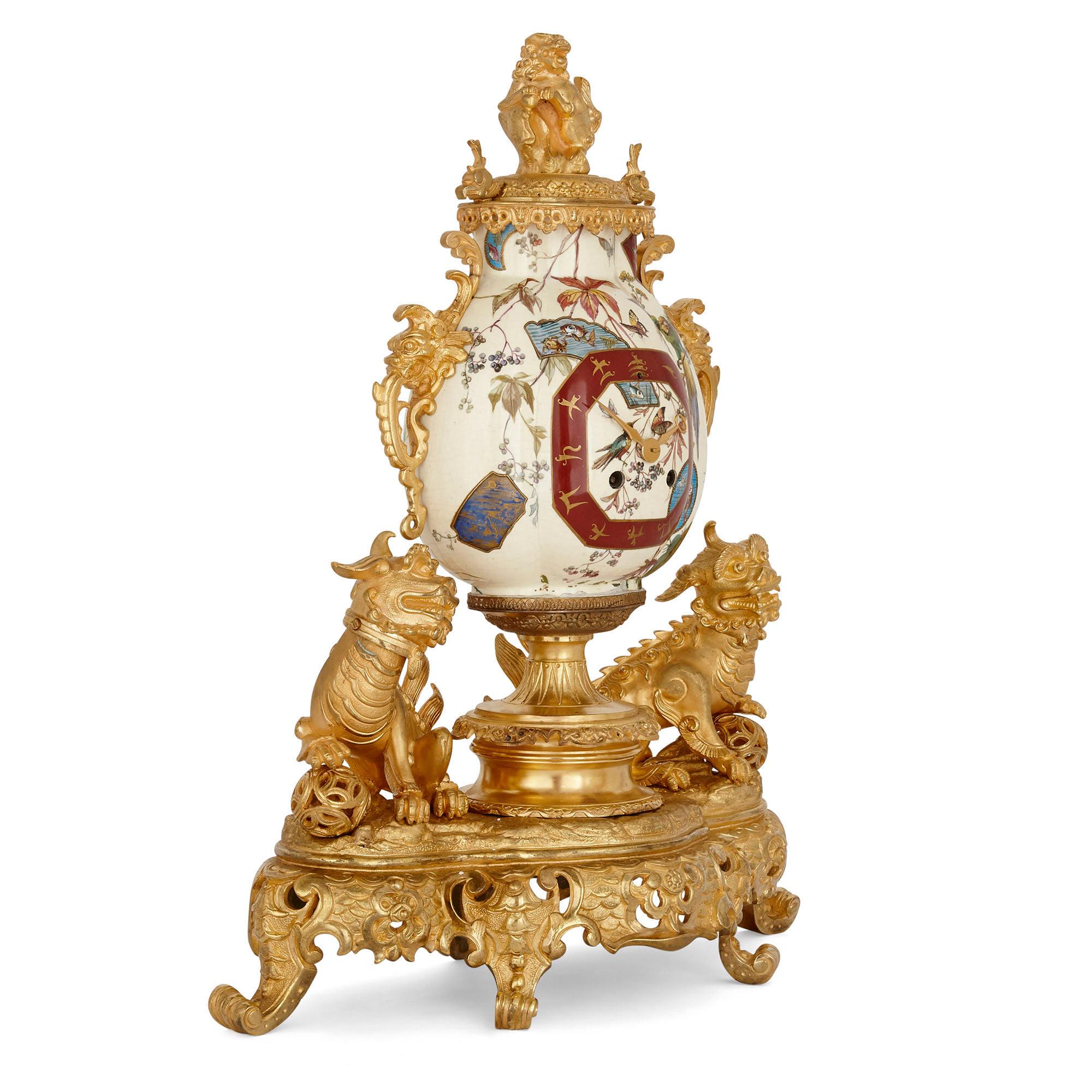 French gilt bronze and faience clock set in the chinoiserie style
French, late 19th century
Clock: Height 52cm, width 43cm, depth 18cm
Candelabra: Height 53cm, width 26cm, depth 18cm

This wonderful clock set, comprised of a mantel clock and