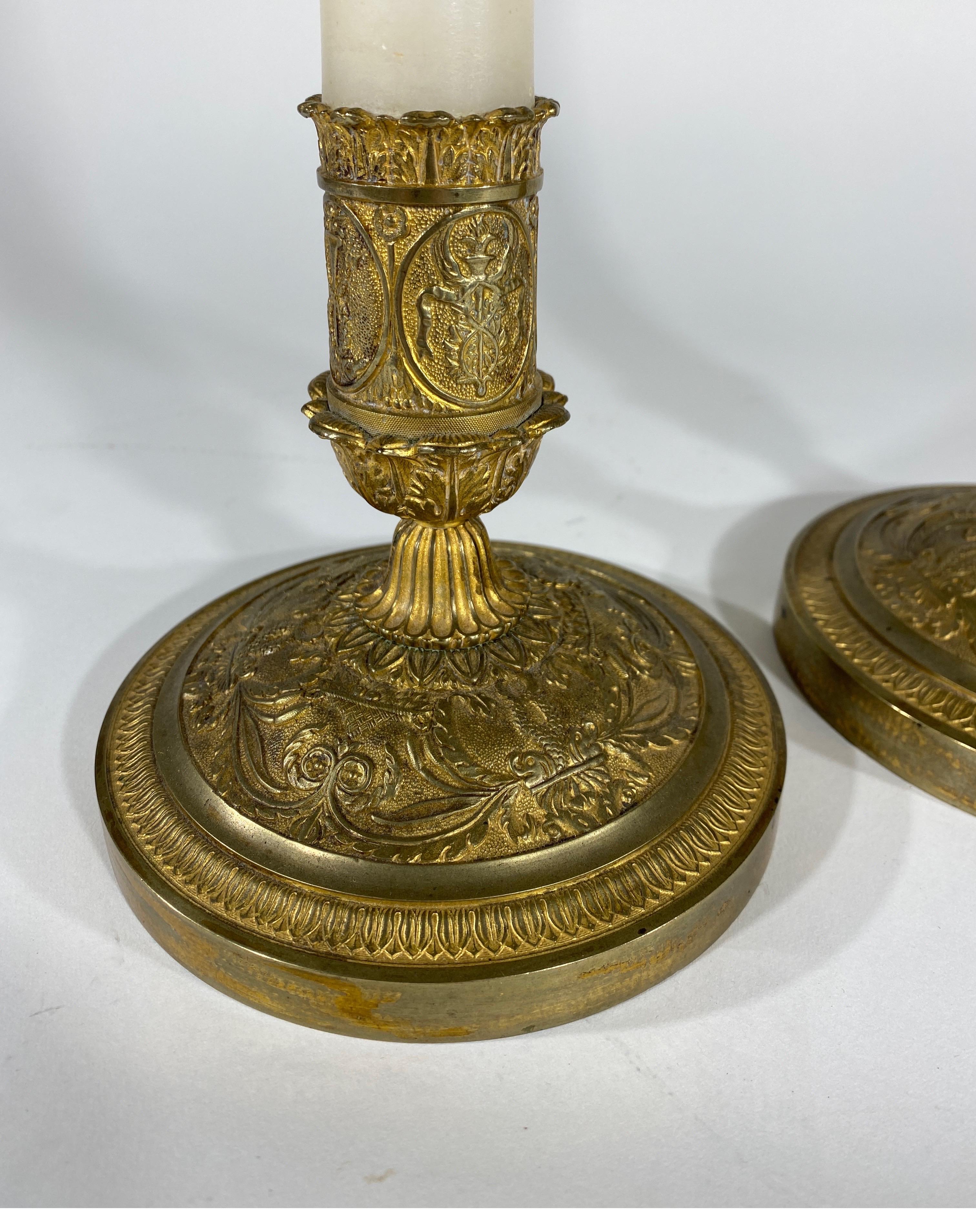 Pair of French gilt bronze candlesticks with marble shafts Excellent casting with dolphins, foliate decoration and ending turning.
 