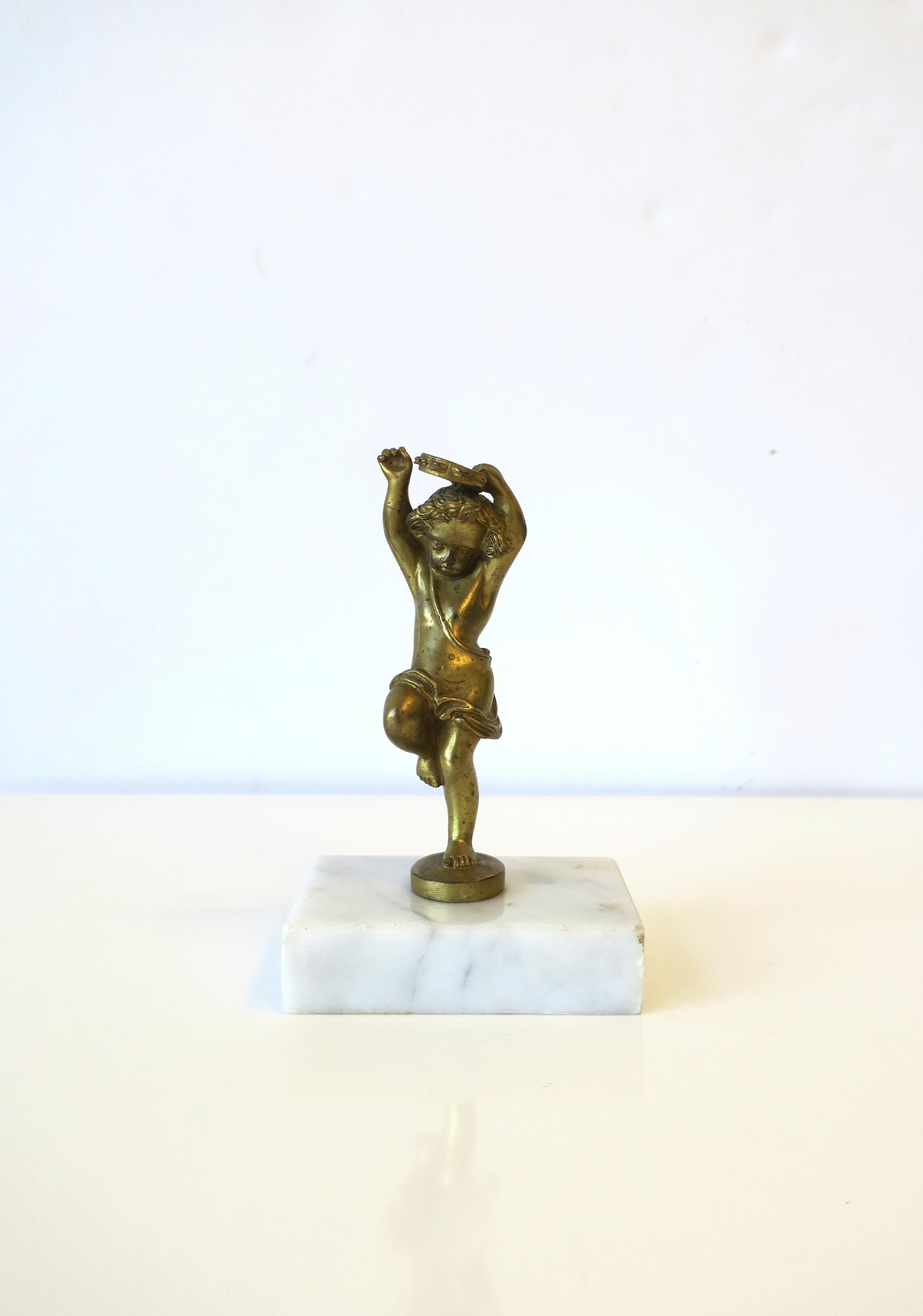 A beautiful, small. French gilt bronze statue in the style of sculptor Hippolyte Francois Moreau, circa late-19th century, France. This gilt bronze statue is in the Louis XVI style. Statue is of a young boy dancing while playing the tambourine,
