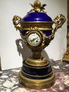 French gilt bronze and porcelain XVI urn form  large clock Circa 1880