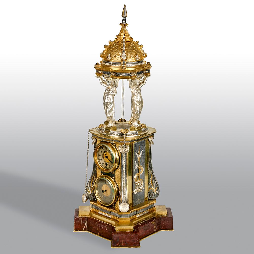 An extremely rare and particularly fine quality automaton clock representing the Wallace Fountains presented to the city of Paris by Sir Richard Wallace in 1872. Simulating water flowing down through the centre is a rotating twisted glass rod which