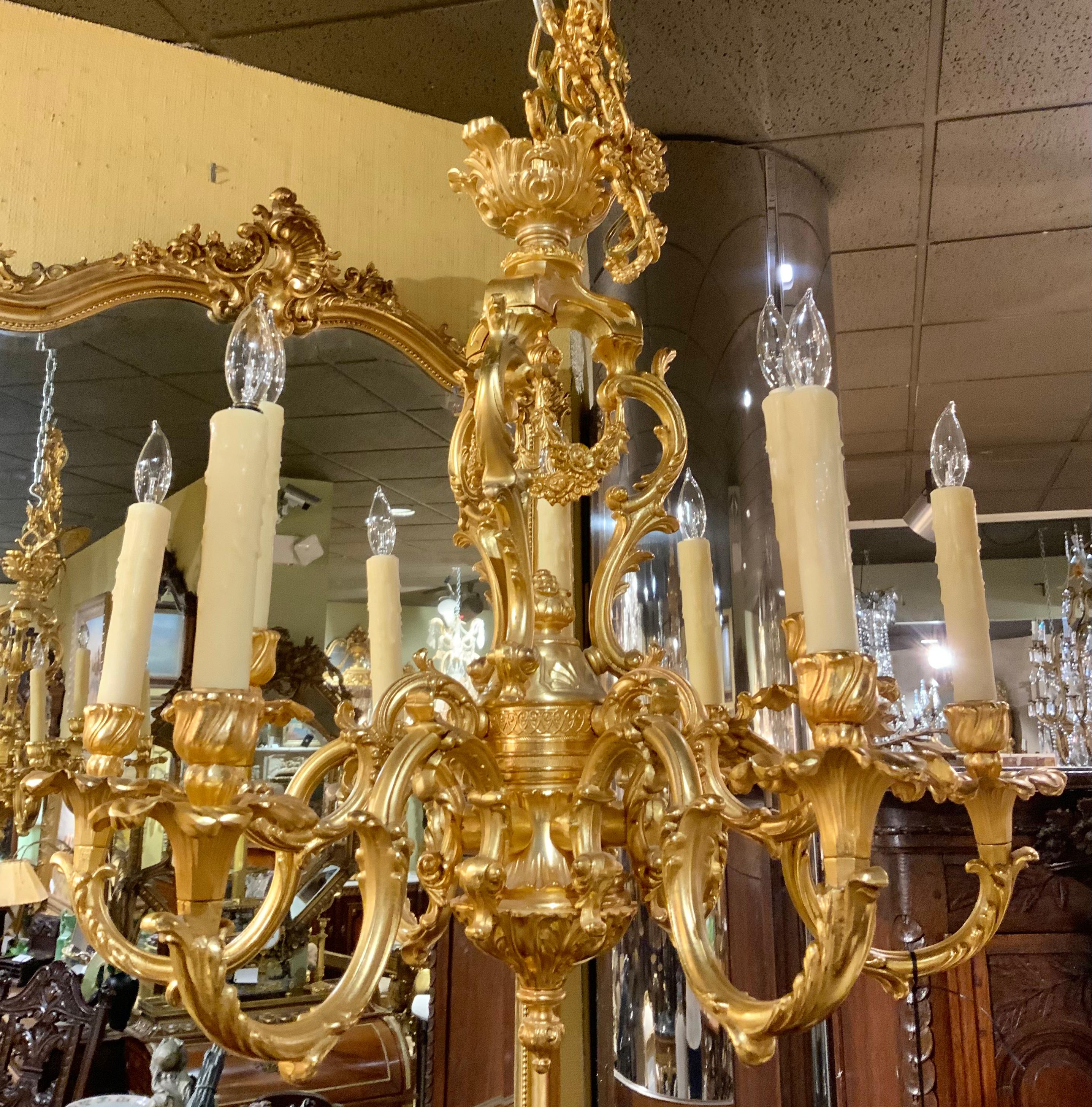 French Gilt bronze chandelier in the Louis XV taste, nine light with floral swag For Sale 2