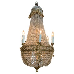Lampadario francese in bronzo dorato con perline di cristallo in stile Impero