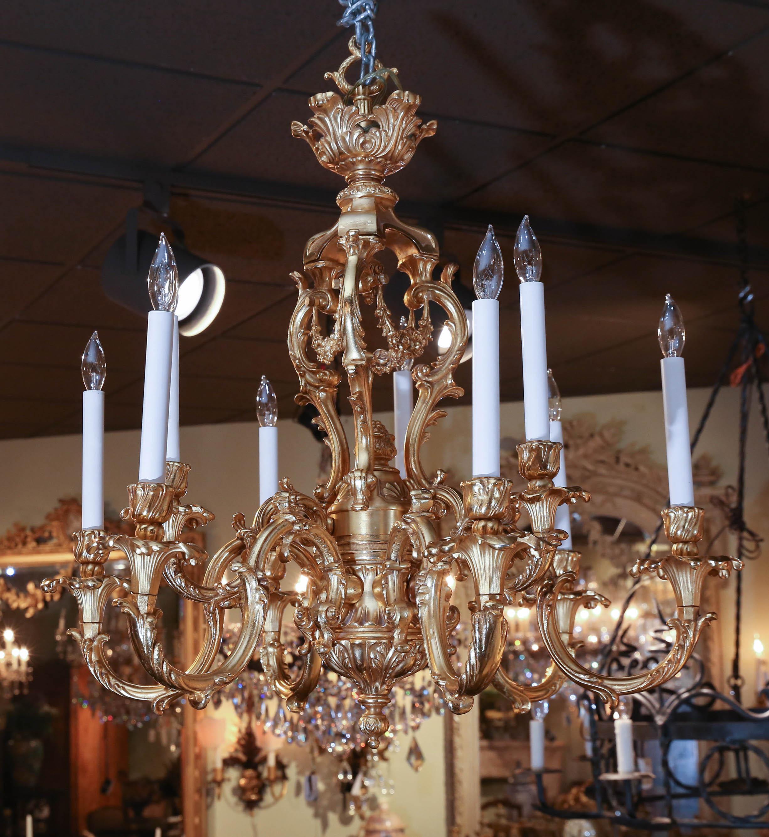 Lovely scrolling arms with tall candles of nine lights. Wired
Floral and foliate delicate draping enhance this beautiful piece.
Bright gold patina.
    