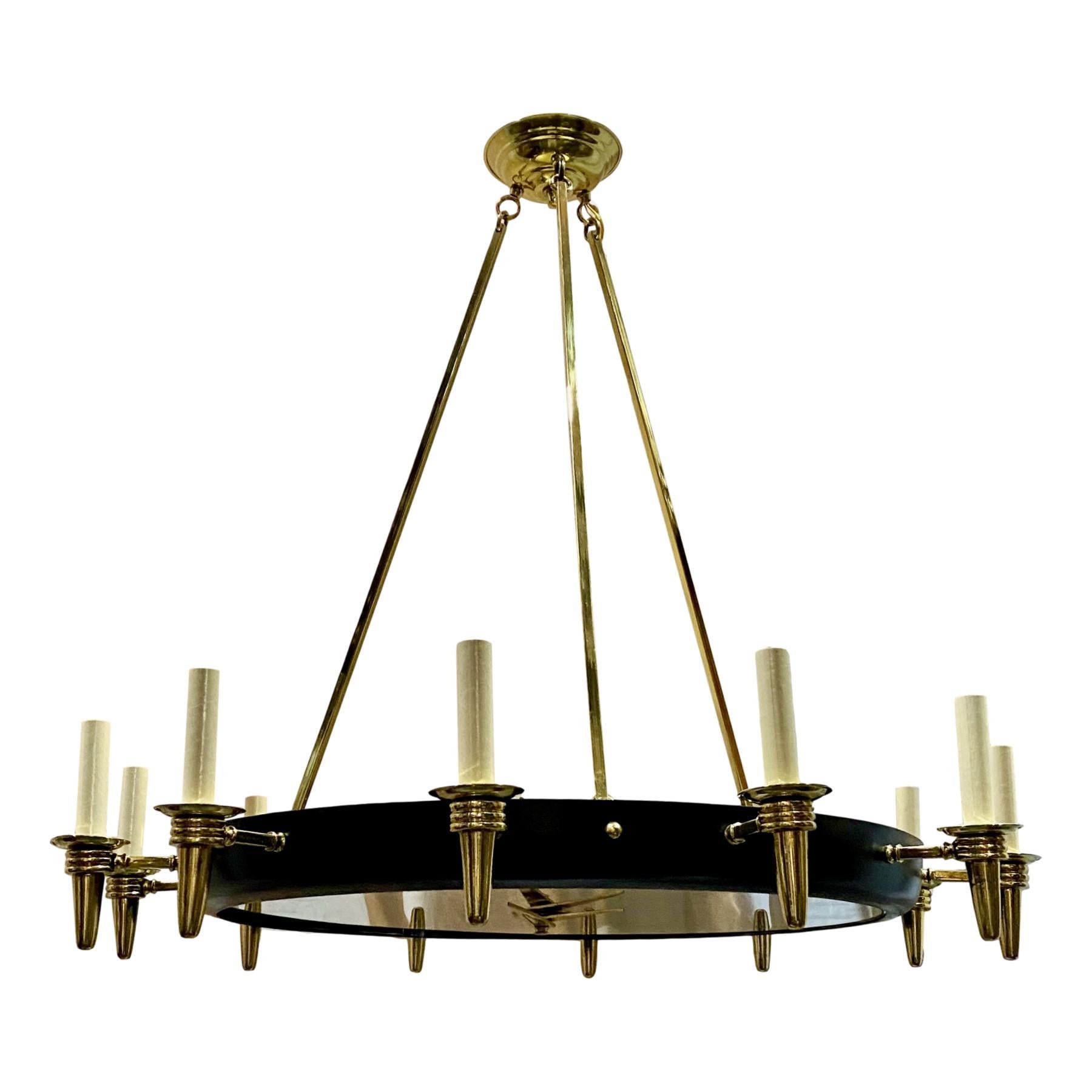 A circa 1960's French polished and painted bronze chandelier with a mirror inset depicting a clock with Roman numerals.
Measurements:
Current drop: 32