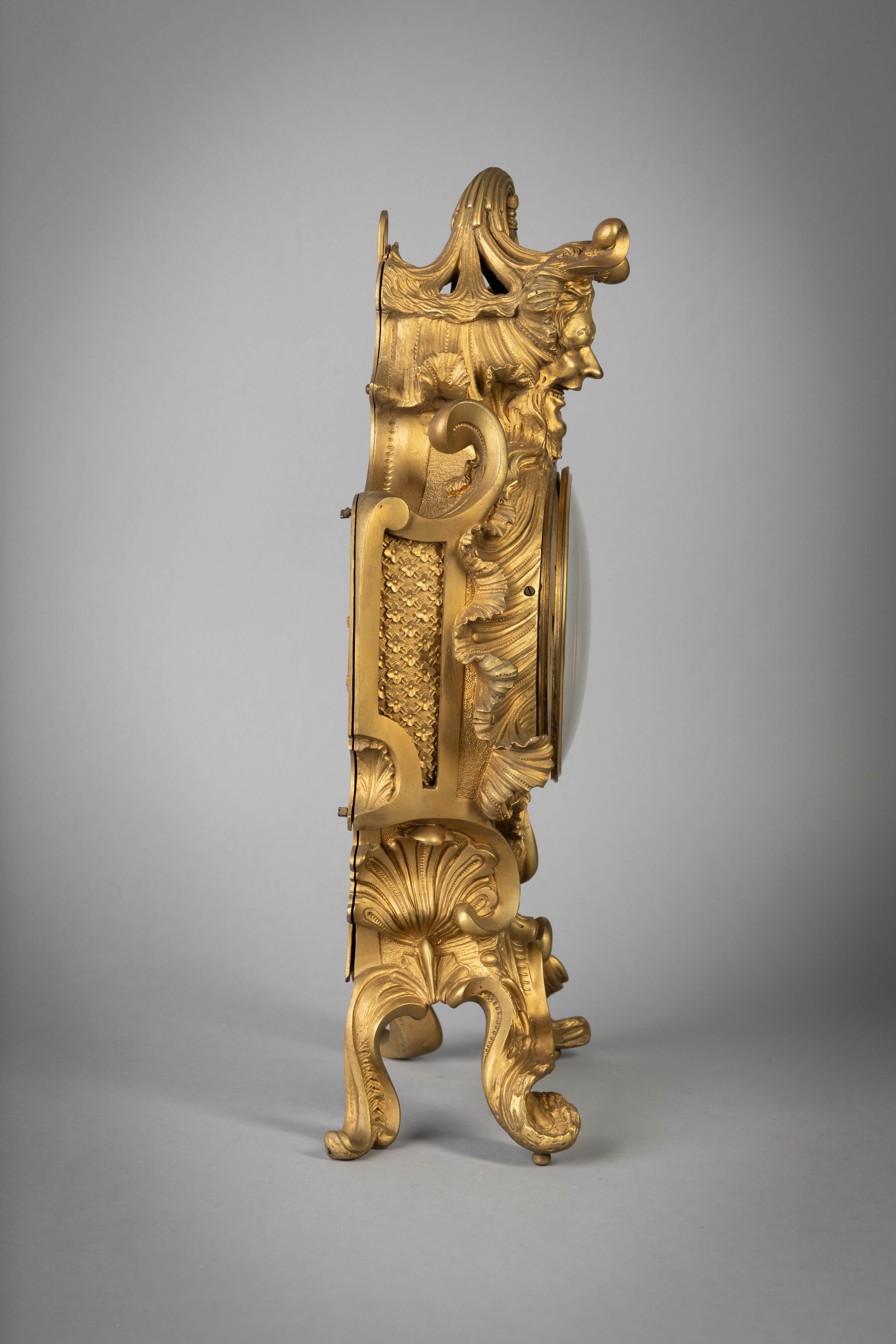 French gilt bronze clock, with Bacchus head, circa 1840.