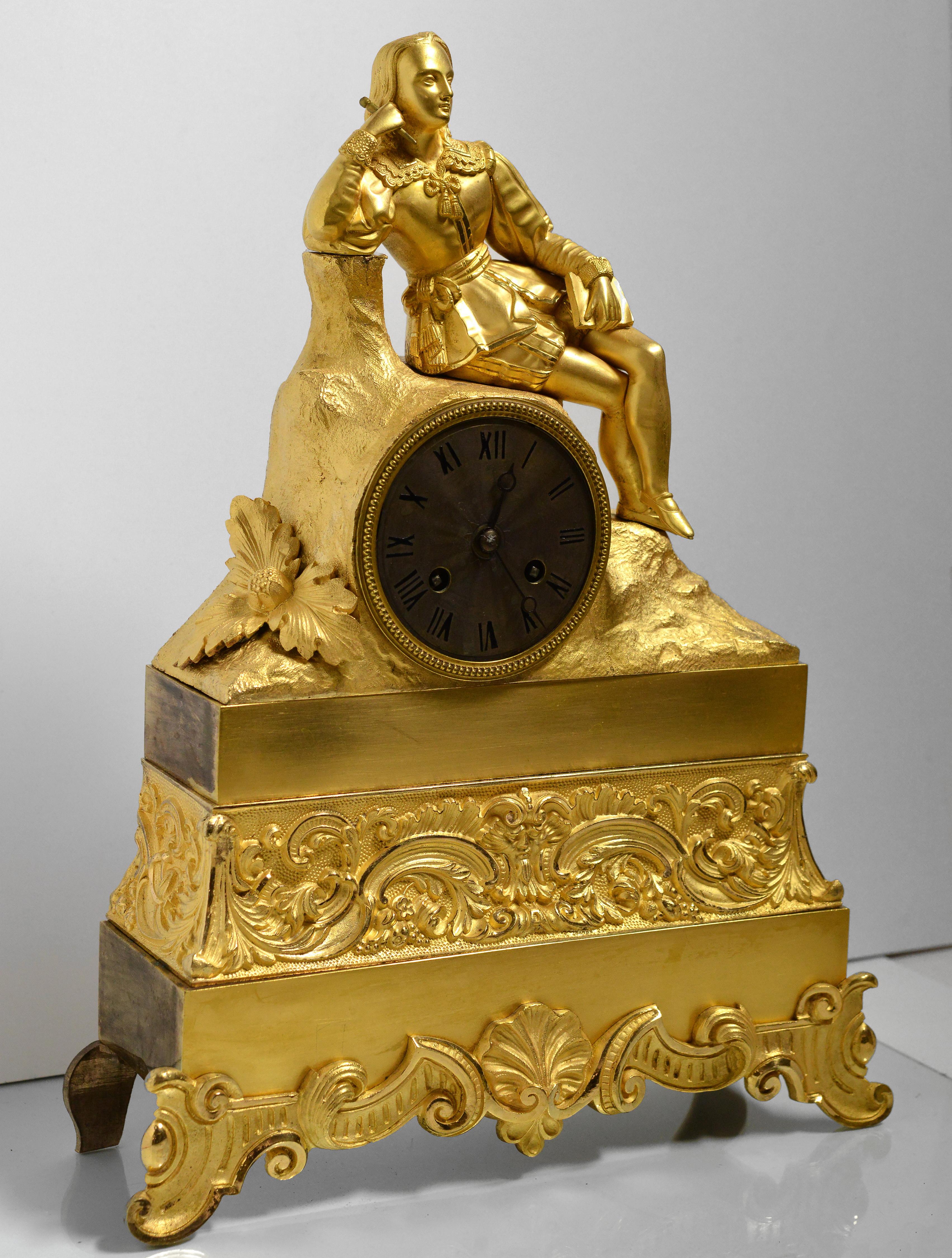 Fine and elegant work of gold-plated bronze as mantel clock in the romantic style. Guilloche silvered dial covered with patina. The bronze sculpture was made using the casting technique from a wax model. At an early 19th centurу, mercury (fire)