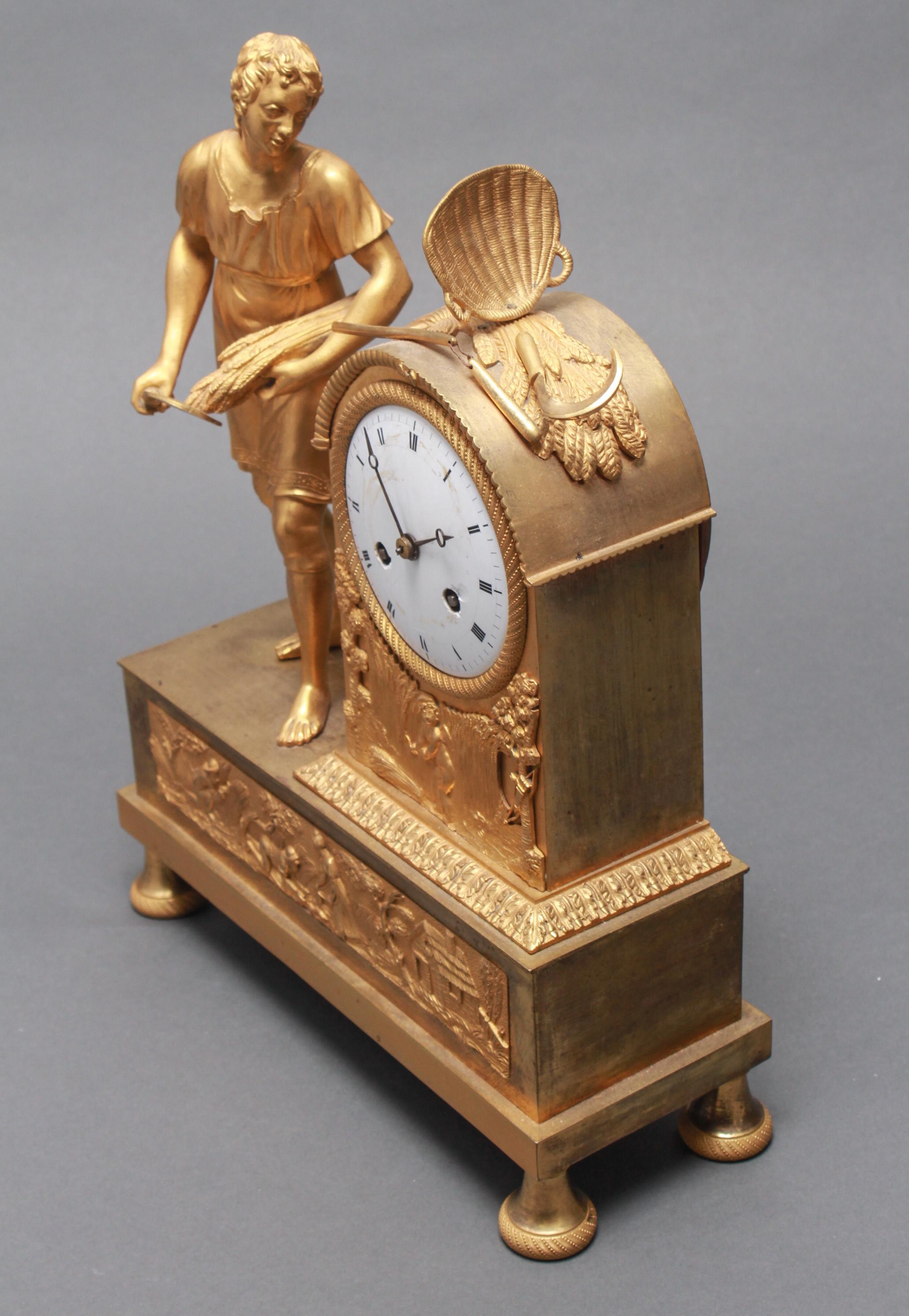 French gilt bronze ormolu figural chiming clock with a white porcelain dial bearing black Roman numerals. The piece features a reaper with a scythe and wheat in his left hand, on a neoclassical base with bun feet. Made during the 19th century. In