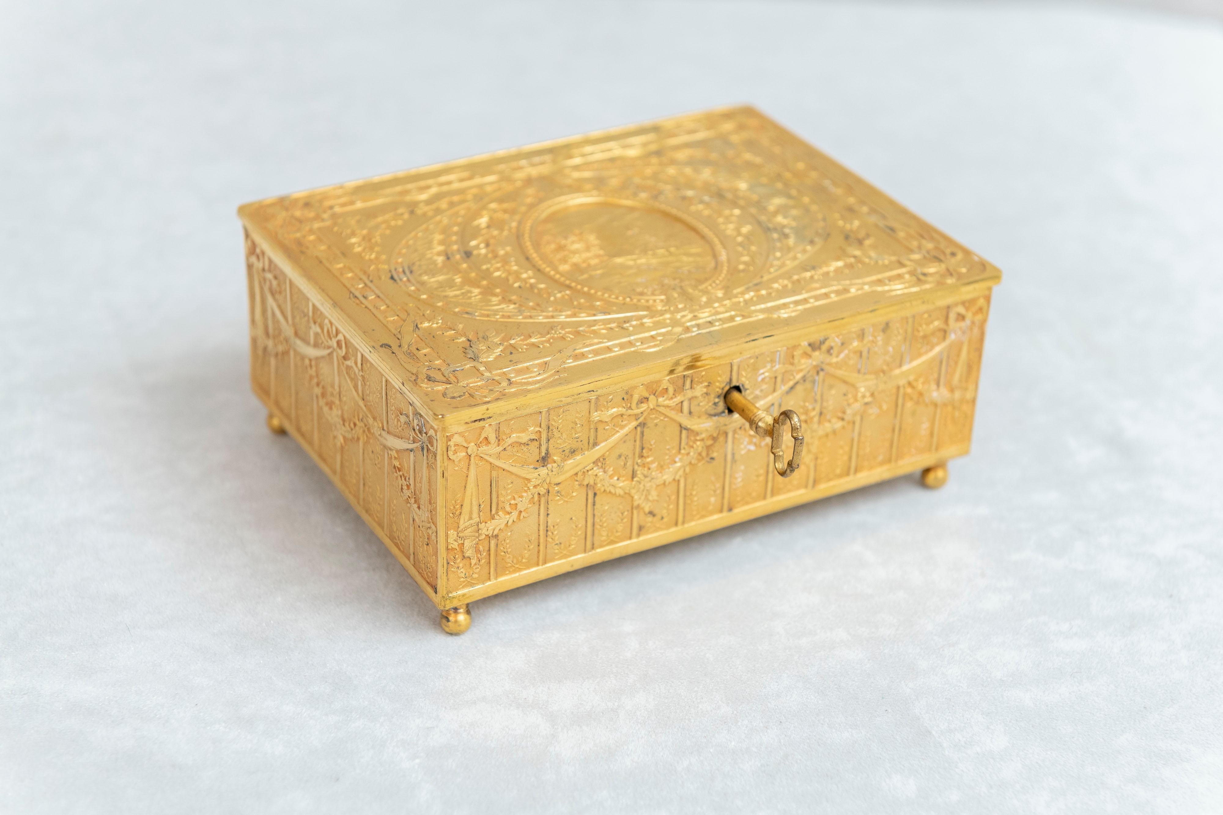 This beautiful box will make the perfect gift your lady. The quality and condition are exceptional, right down to the luscious original lining. Really, as nice a little jewelry box as we have offered in quite sometime. The original key is present,