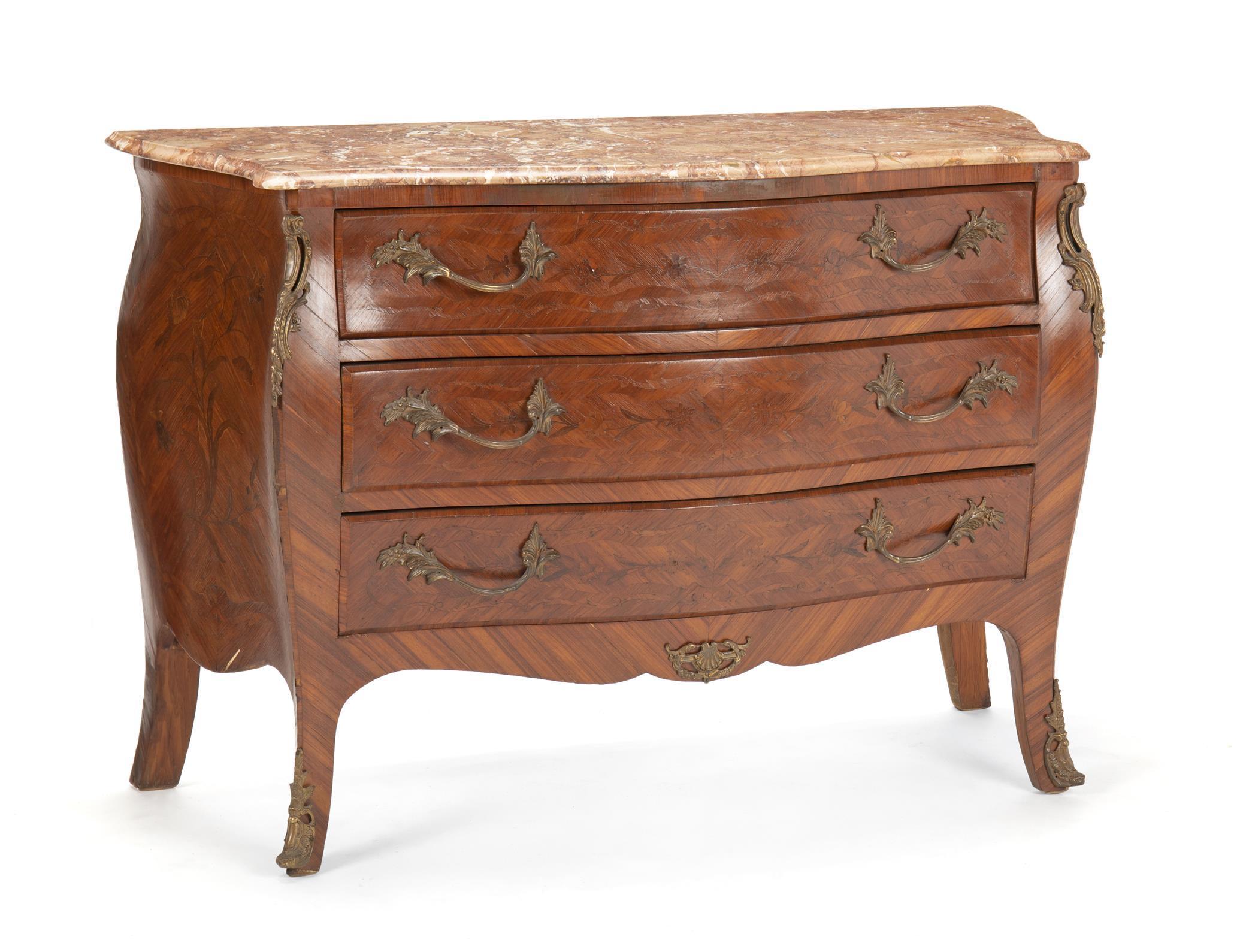 Lovely French Louis XV style gilt bronze mounted commode. 
Late 19th-early 20th century.
Serpentine-fronted mottled marble top, above a veneered commode fitted with three long drawers mounted with foliate-inspired handles, the sides exhibiting a