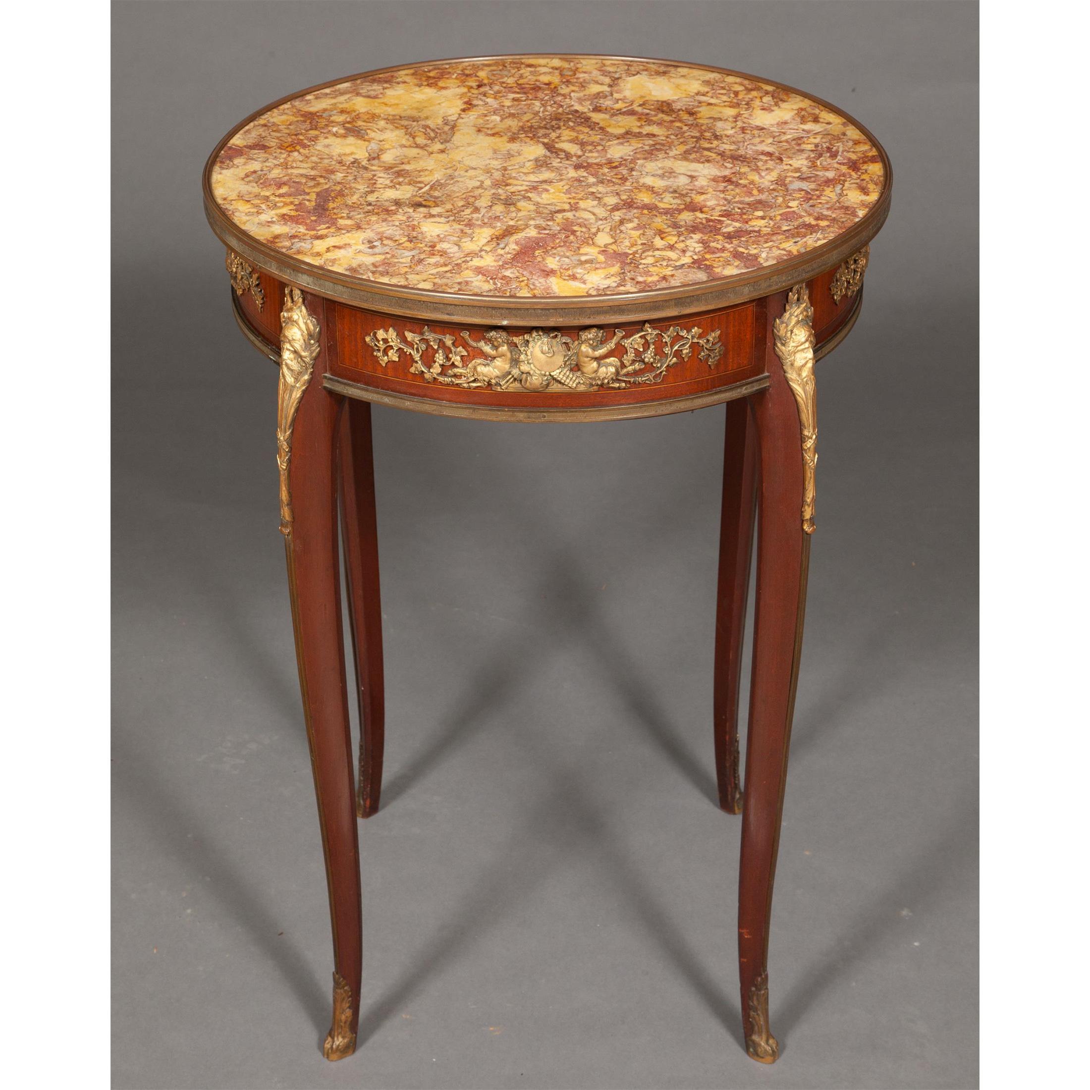A fine quality French gilt-bronze mounted mahogany marble-top round corner table.

Date: 19th century
Origin: French
Dimension: 29 in. x 21 1/2 in.