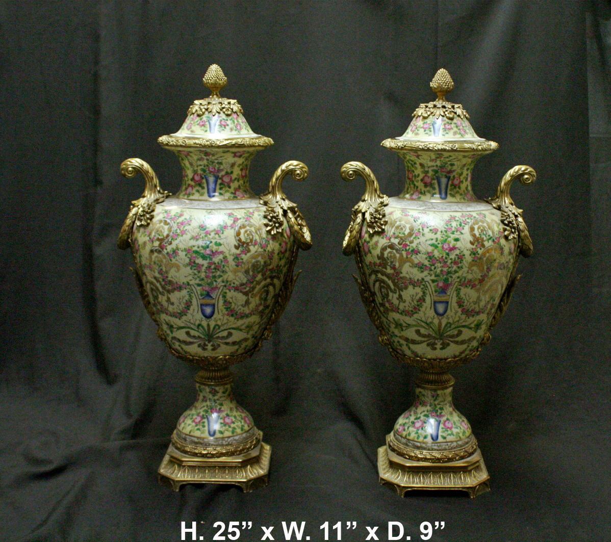 Outstanding and very impressive French style painted ormolu mounted porcelain three piece garniture. 
The centerpiece is a hand-decorated porcelain bowl over gilt bronze set of three maidens in Neoclassical garments each holding a delicate chain