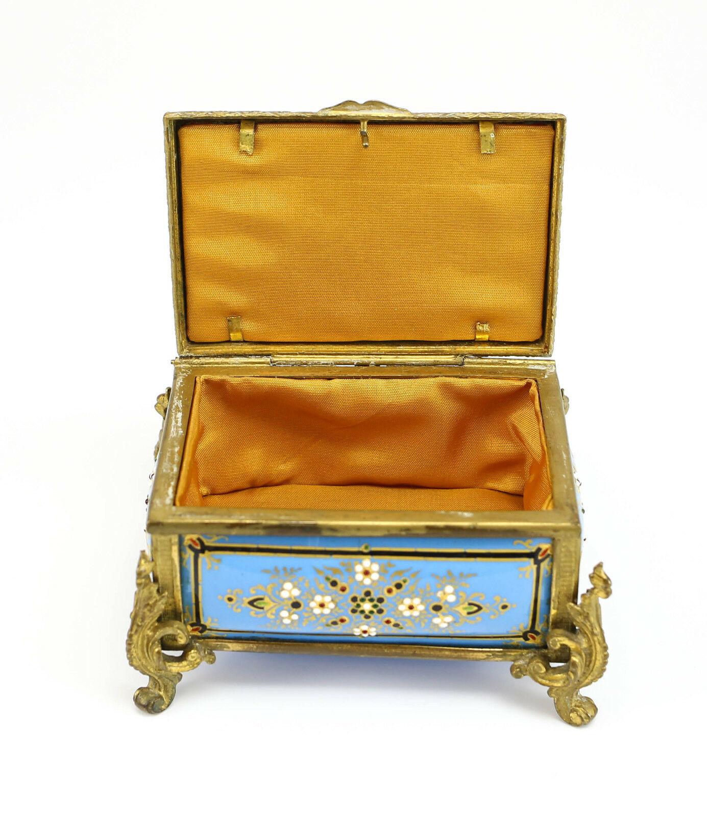 French gilt bronze & porcelain jewelry box, powder blue & raised floral enamel.

Additional Information:
Brand: Unbranded 
Type: Jewelry Box
Color: Blue
Dimension: 4”x 2.875 x 2.75
Condition: Good condition. Light oxidation to the bronze.