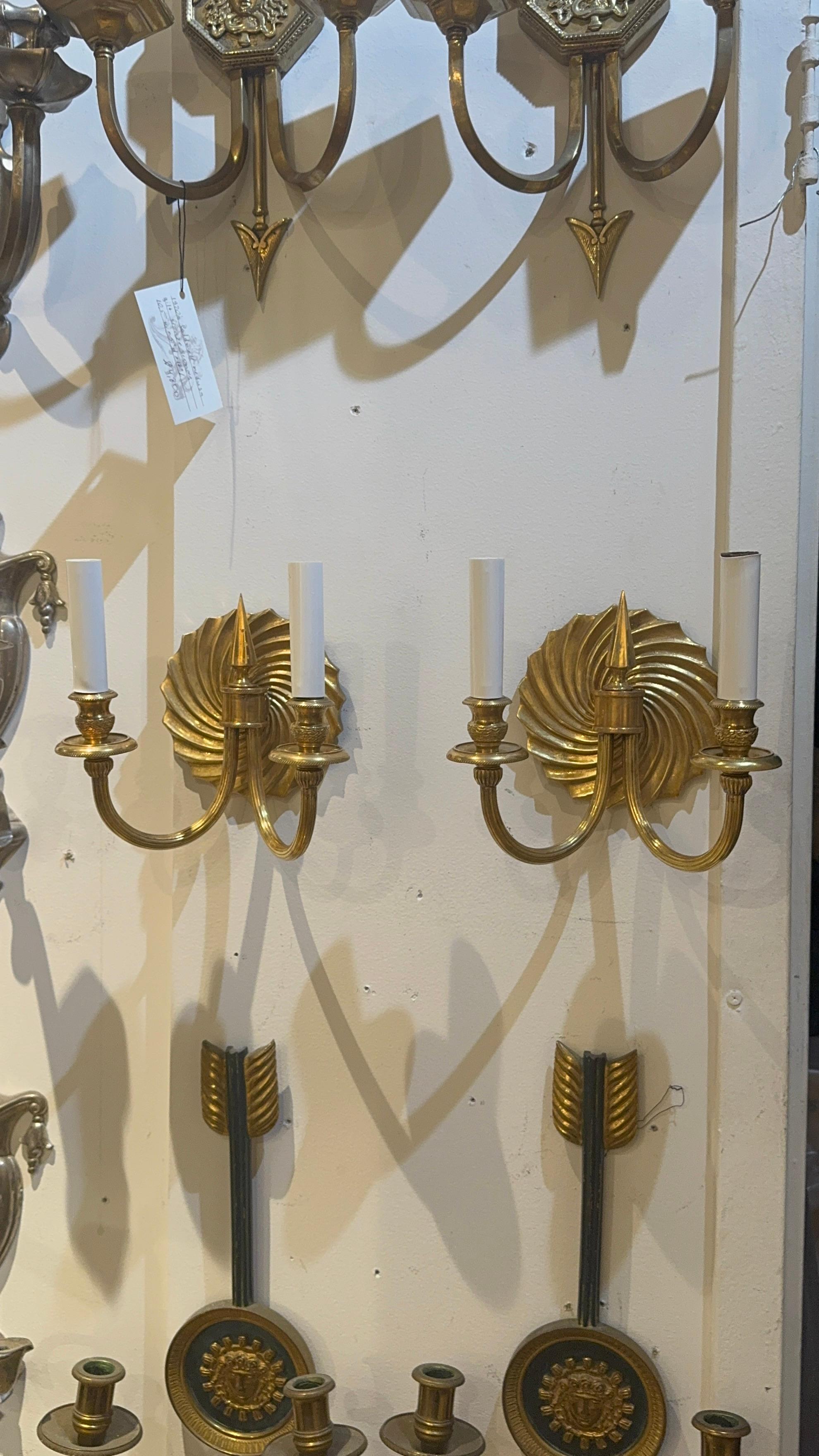 A pair of 1940’s French gilt bronze swirled designed backplate 