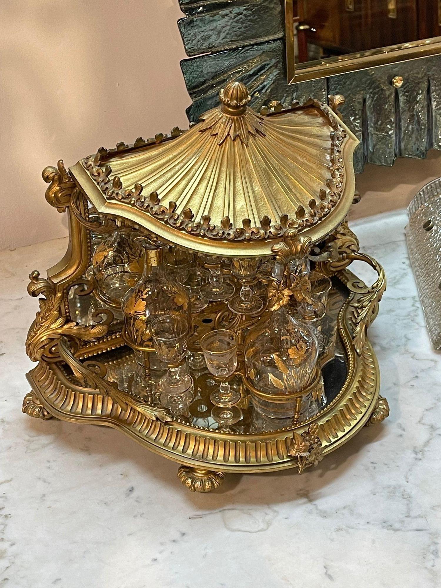 Fine 19th century French gilt bronze tantalus set, attributed to Baccarat. Circa 1870. A fine addition to any home! A timeless and classic touch for a fine interior.
