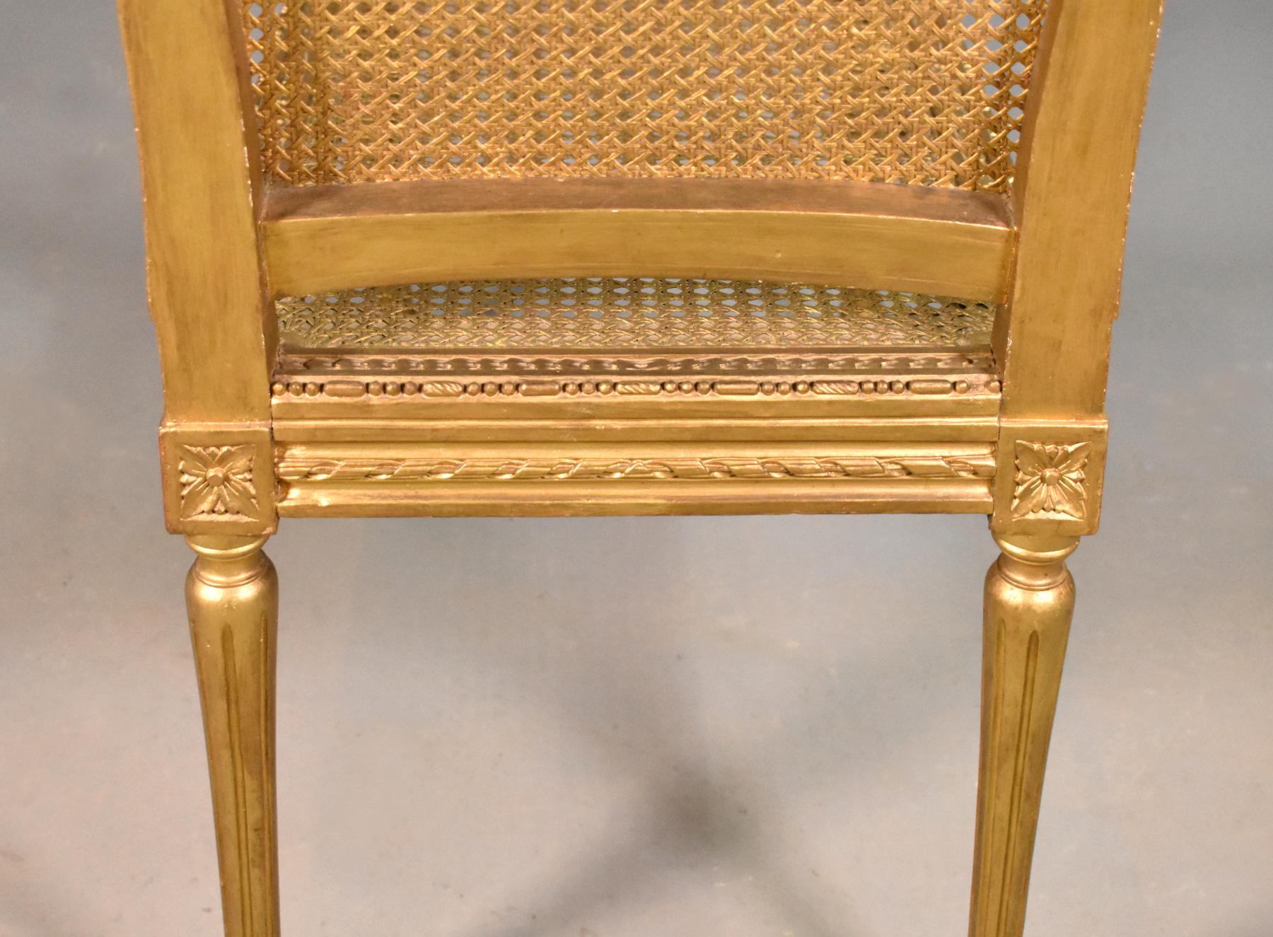 French Gilt Cane bench Louis XVI Style 

A delightful gilt bench with a profusion of decorative moulding design and floral motifs to each corner. 

The bench stands on turned tapered fluted legs. 

The cane is tight and in very good condition.