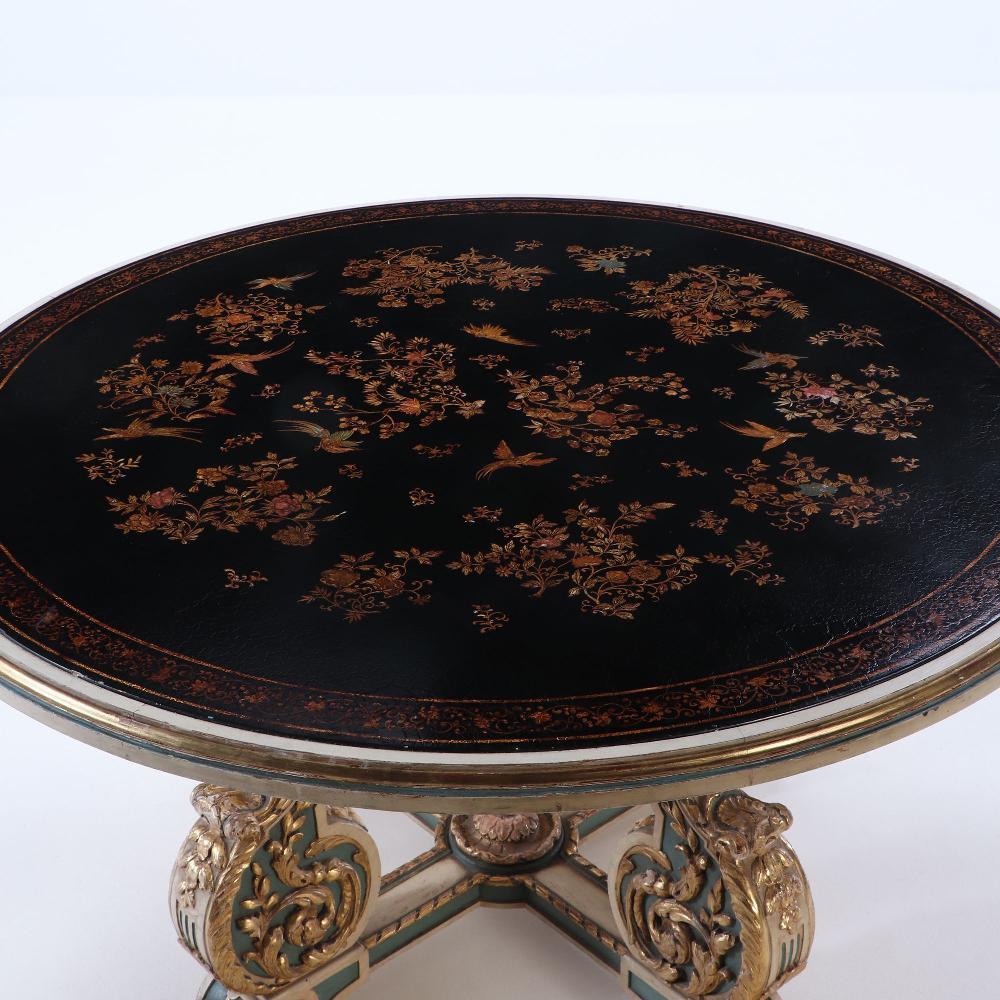 French gilt carved and painted round table with decorated lacquered top attributed to Jansen C 1945.