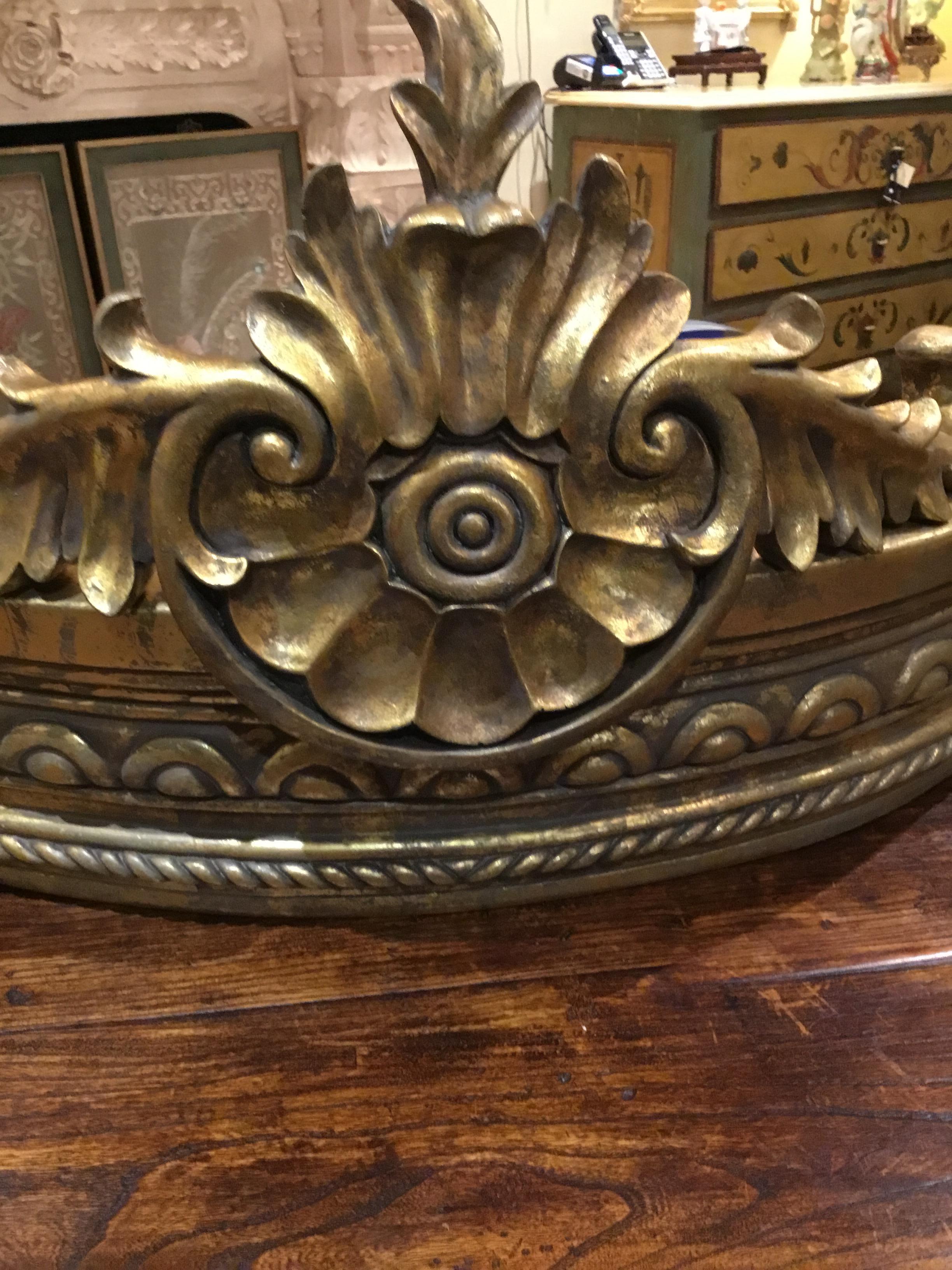 Architectural French style carved gilt composition crown/cornice, with foliate and
Spiral twists motif. Antique gold finish. It has a bracket for hanging in the back.
Great centerpiece for draping a bed.