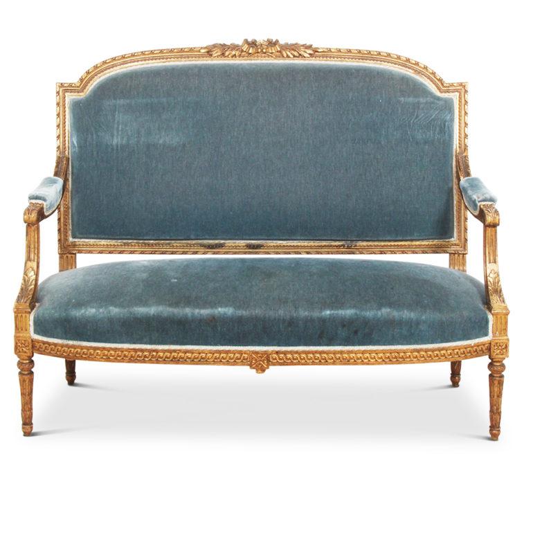 Hard-to-find French 19th century carved and gilt five-piece Louis XVI-style salon suite consisting of four ‘fauteuils’ or armchairs, and a settee.

Fine neoclassical carved details throughout, including elegant tapering fluted legs, circa