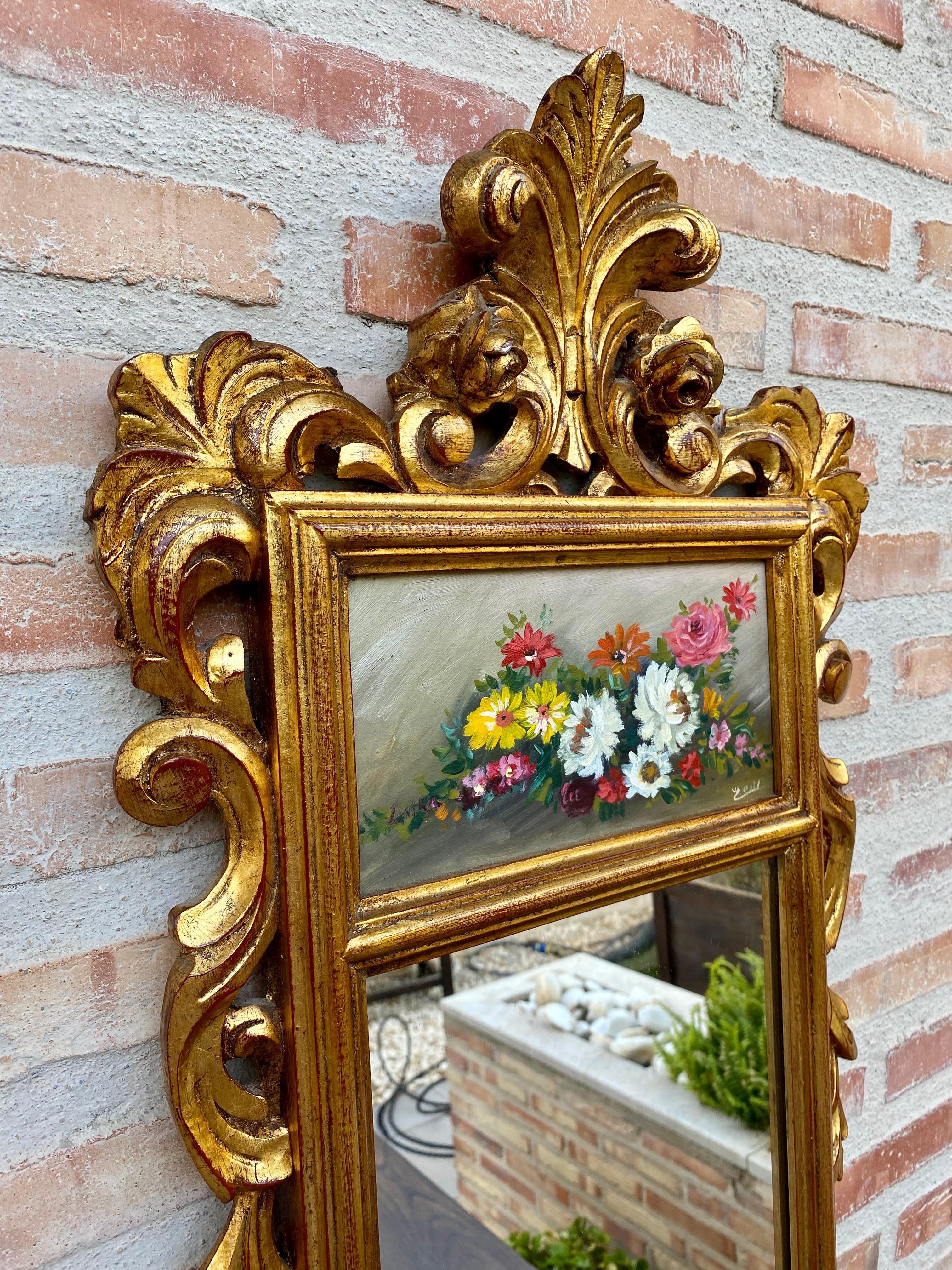 Beautiful French gilt carved wall mirror in French Rococo style with oil painting of floral motifs.
French Rococo style gilt carved French wall mirror with oil painting of floral motifs.
Stunning Italian carved wood and gilt gilt wall mirror from