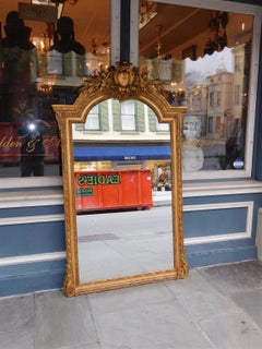 French Gilt Carved Wood and Gesso Cherub Acanthus Wall Mirror. Circa 1820