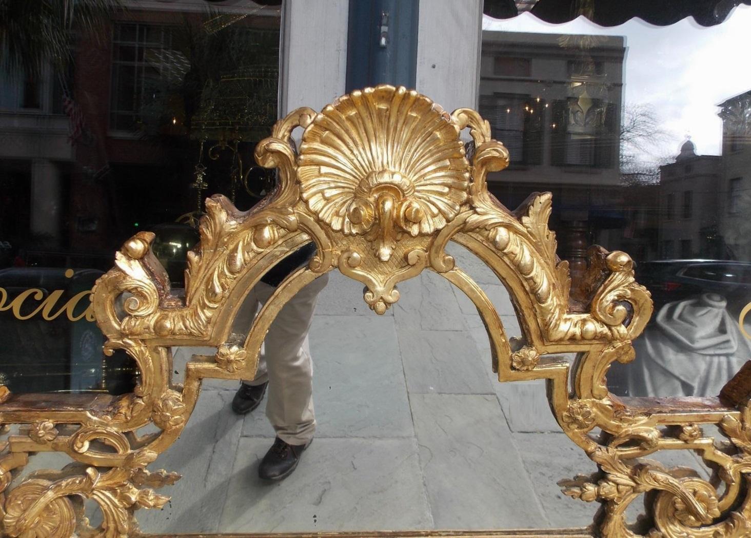 French Gilt Carved Wood Floral and Shell Wall Mirror with Original Glass C. 1750 In Excellent Condition For Sale In Hollywood, SC