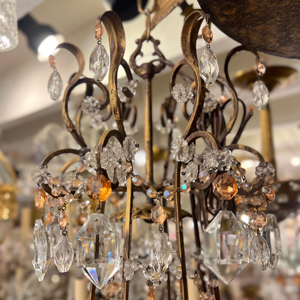 A circa 1920s French gilt metal chandelier with crystal beads and glass pendants with 8 candelabra lights.

Measurements:
Height: 33