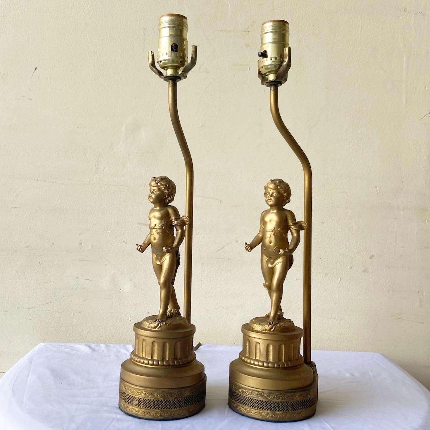 Amazing pair of French gilt metal table lamps. Each display a gilded cherub by Fabrication Francaise.

One way lighting
