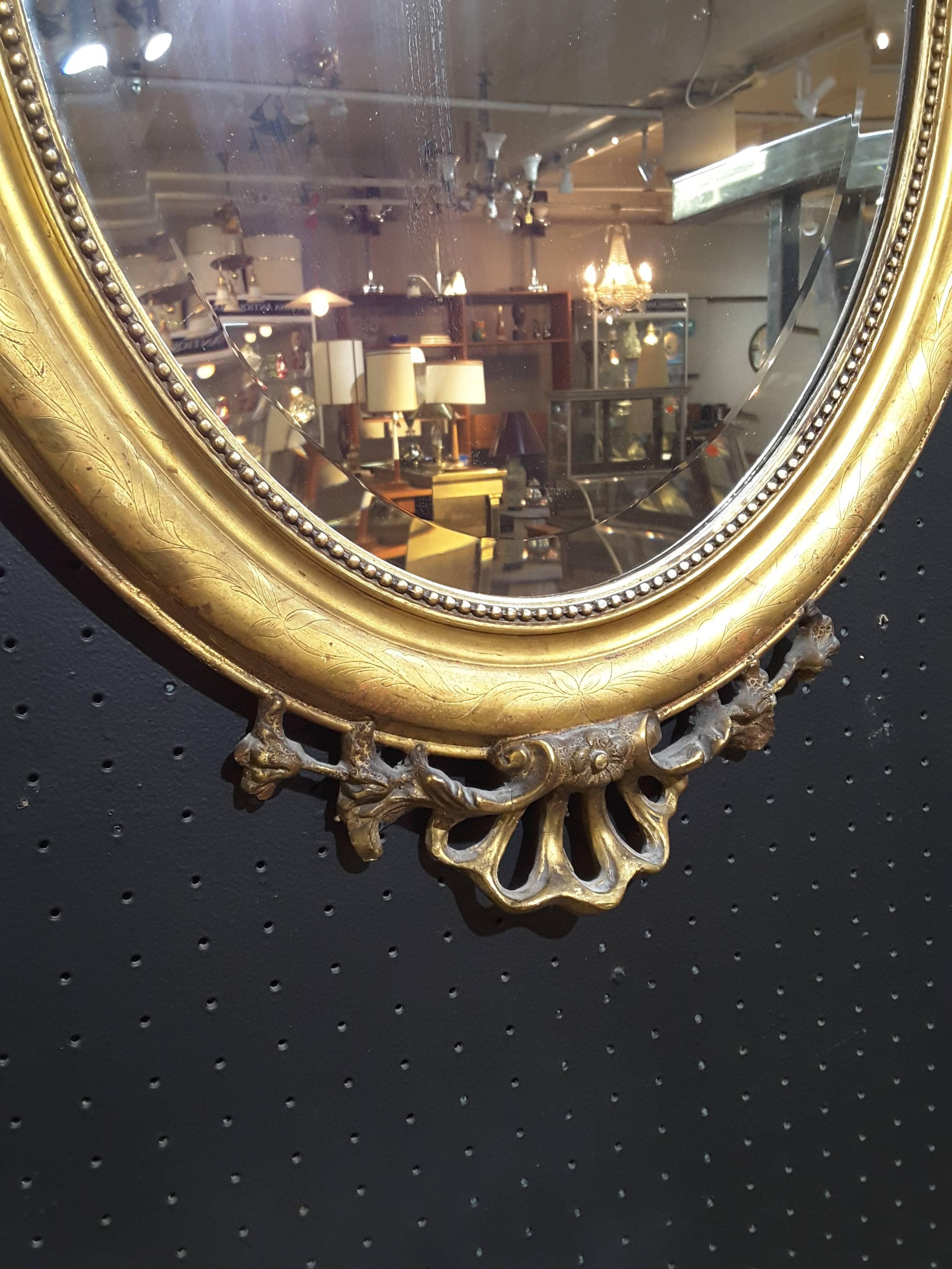Louis XVI French Gilt Cherub Oval Bevelled Mirror, 19th Century