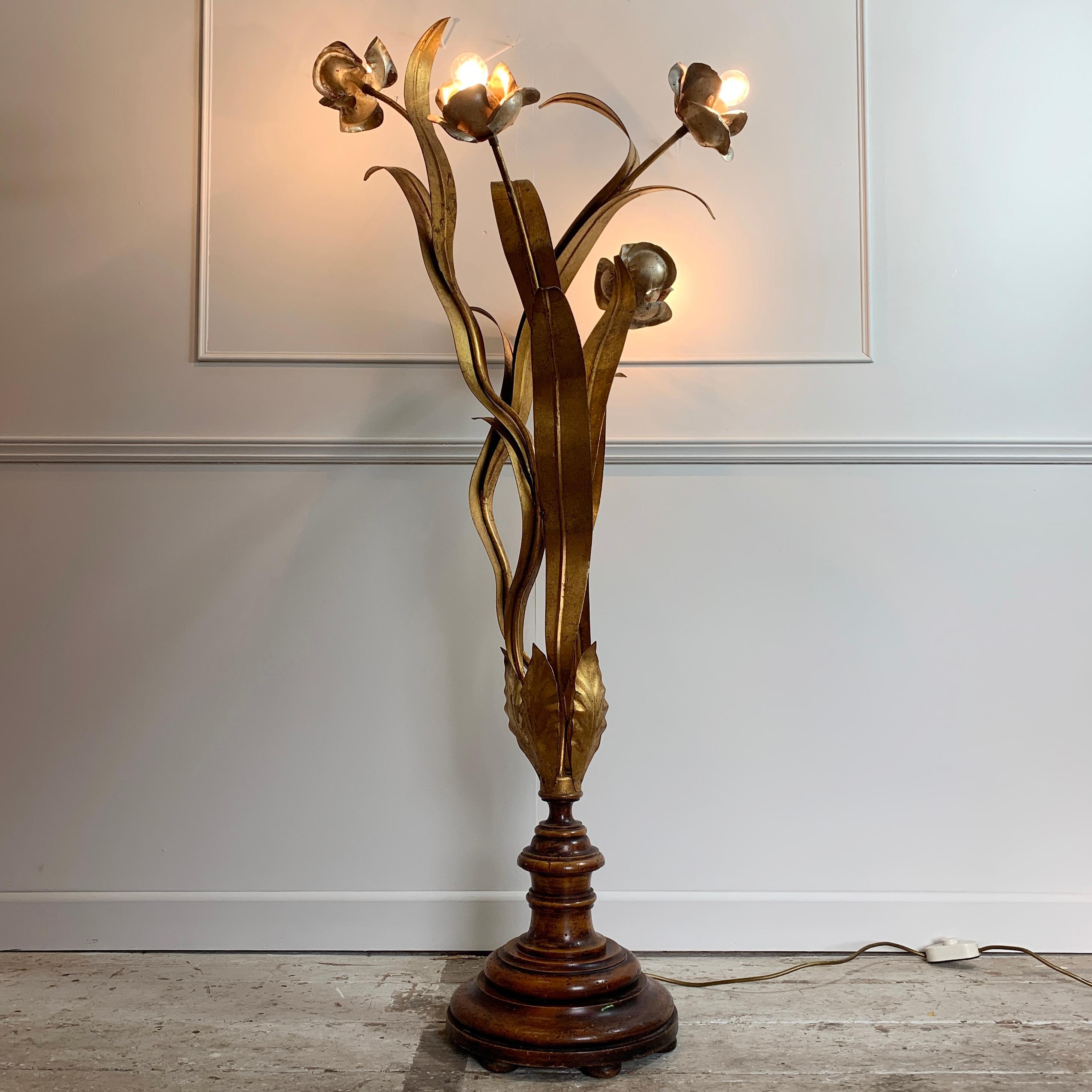 Stunning rare midcentury gilt flower floor lamp
Wide large gold leaves surround 4 stems topped with large silver flowers
Original gold leaf and silver leaf finish to all parts
France, circa 1960s
Beautiful turned wooden base
Measures: 148cm