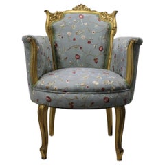 Poltrona francese con cornice dorata e tappezzeria floreale
