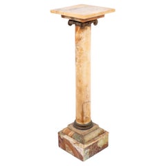 Piedistallo francese in metallo dorato e onice, XIX secolo.