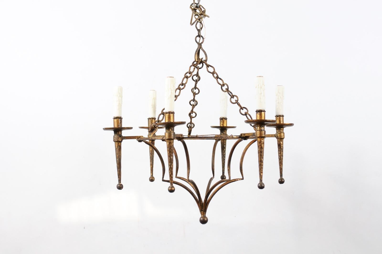 A French gilt metal chandelier with 6 lights. Recently wired for U.S.A Electricity.