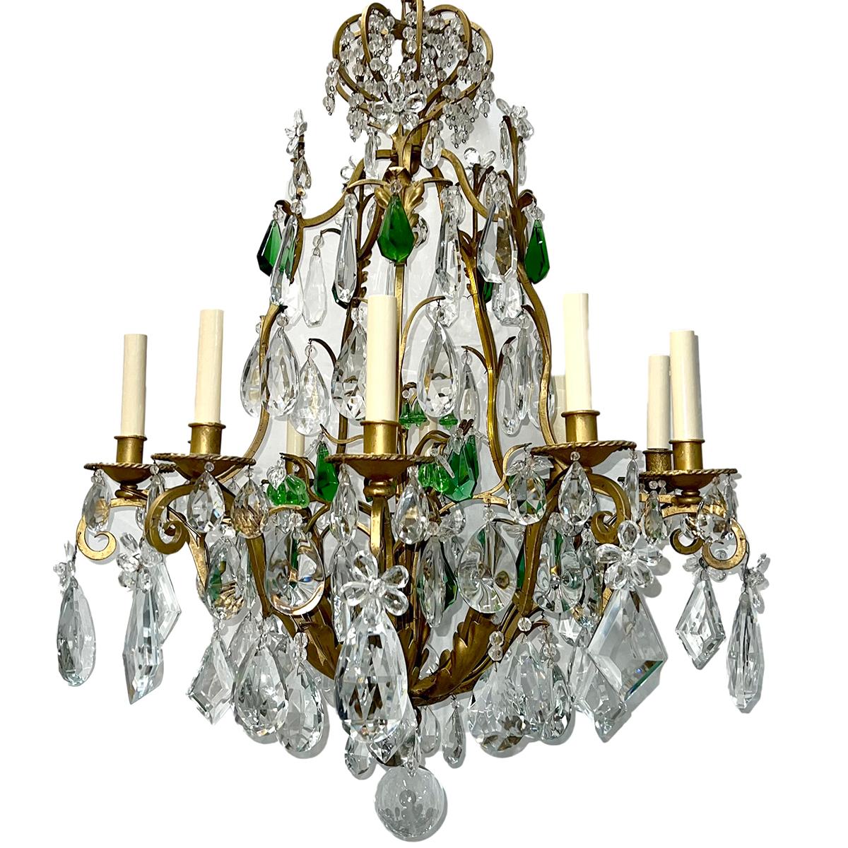 A circa 1920's gilt metal ten-arm chandelier with emerald green crystals.

Measurements:
Diameter: 26