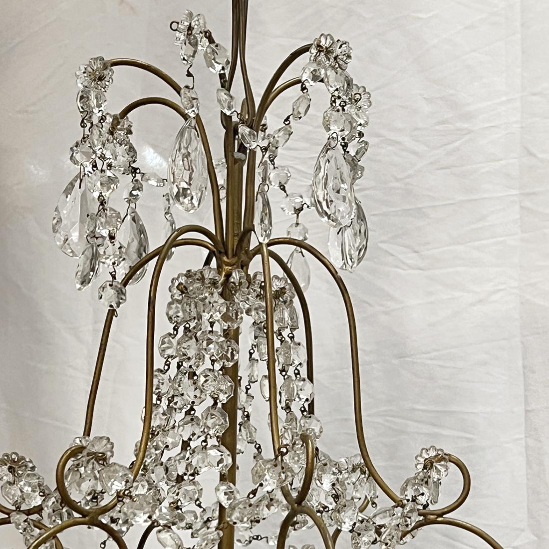 A circa 1960's French light fixture with crystal flowers and 3 interior lights.

Measurements:
Diameter: 16