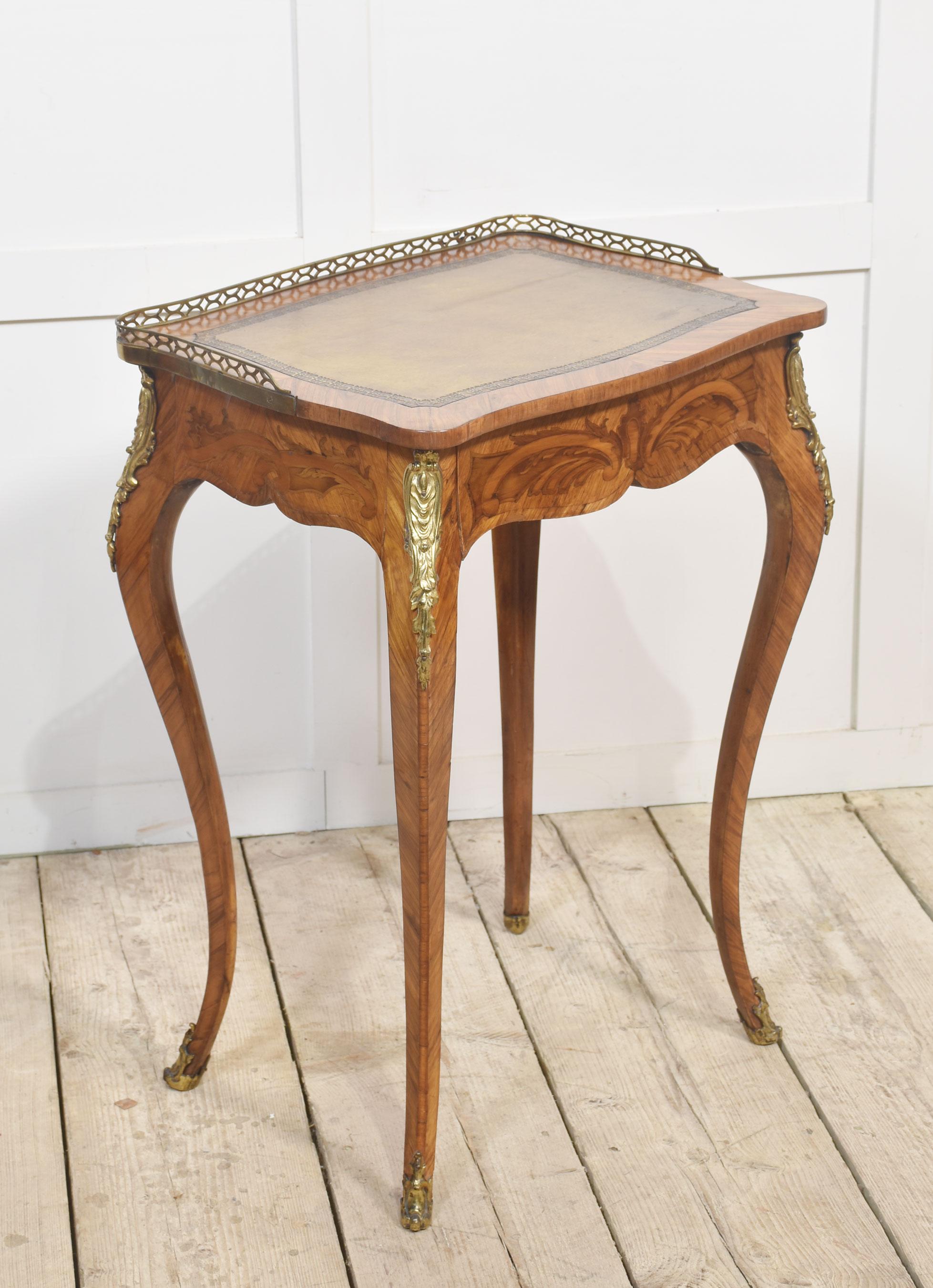 French gilt-metal mounted marquetry side table, of Louis XV style, the pierced brass gallery above inset leather writing surface to the frieze fitted with a long drawer. All raised on slender cabriole supports.
Dimensions
Height 29 Inches
Width 21