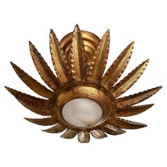 Luminaire en métal doré