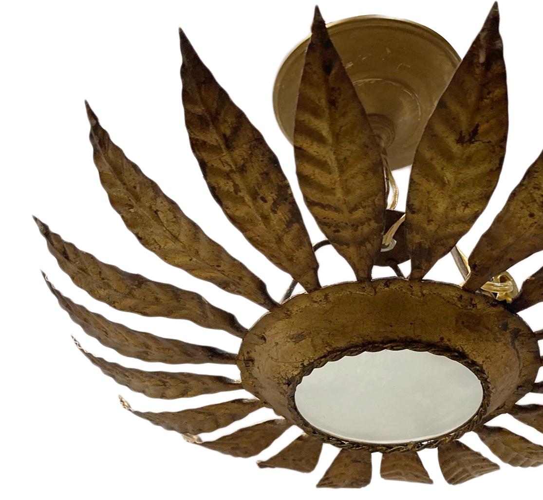 A circa 1960s French hammered and gilt metal light fixture with original finish and frosted glass.

Measurements:
Height 8