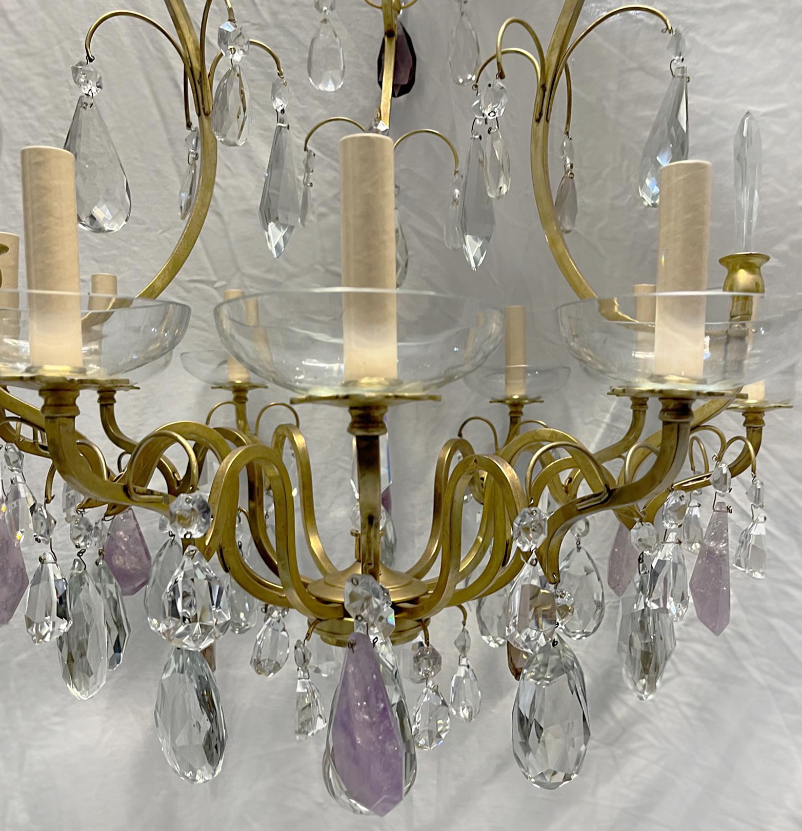 A circa 1920's French gilt bronze chandelier with 9 lights, with amethyst rock crystal pendants.

Measurements:
Diameter: 30